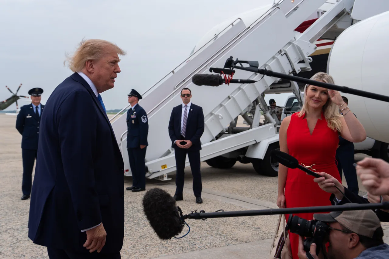 Leavitt stands out beside Trump