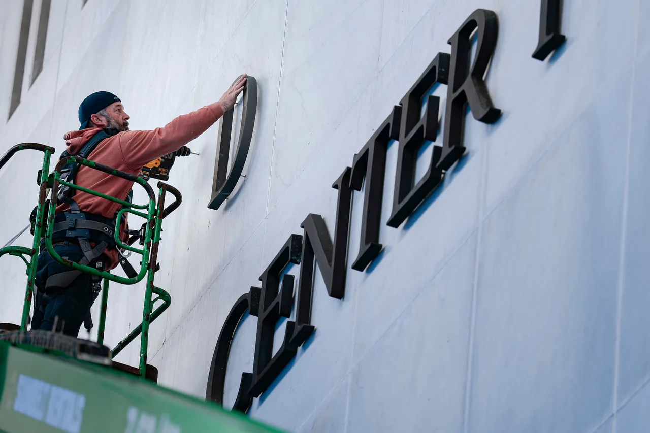 Trump’s name appears across the facade