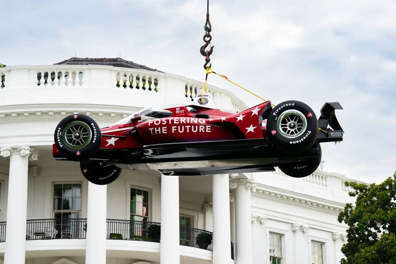 1,700-pound race car dangles above the White House