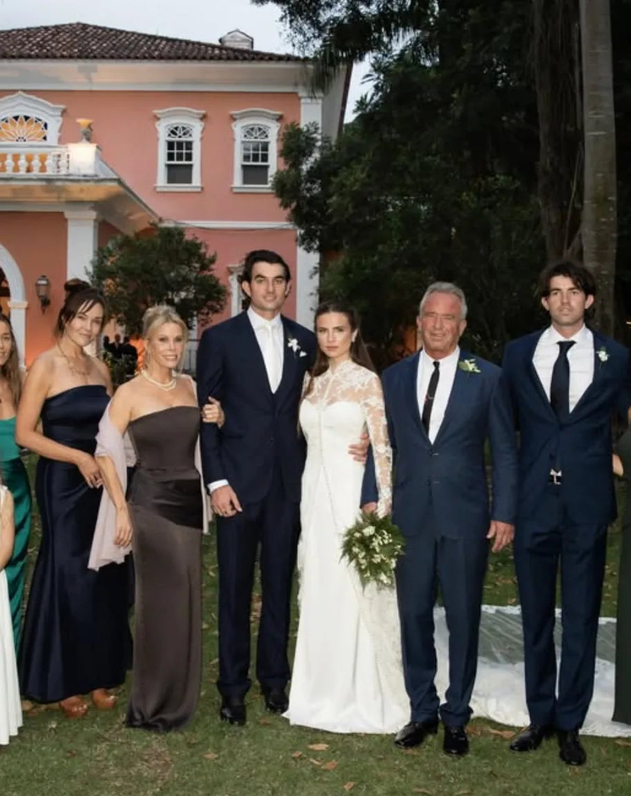 RFK Jr poses beside the newlyweds