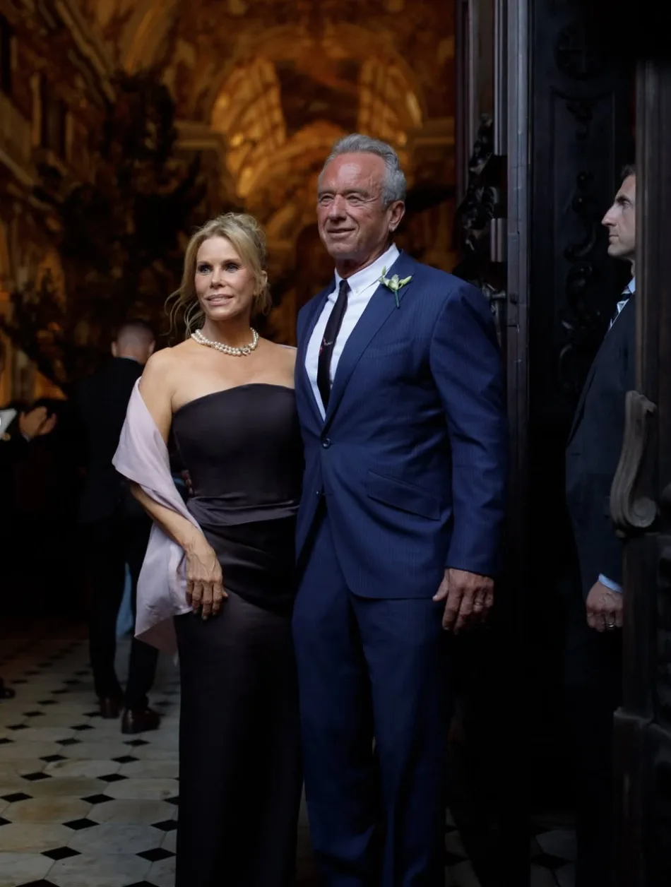 RFK Jr and Cheryl Hines pose outside the cathedral