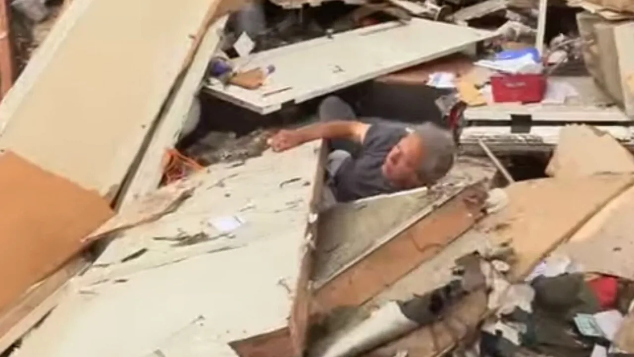 Storm chaser dramatically rescues elderly man trapped in rubble as massive tornados rip through Illinois