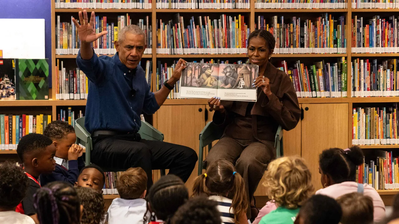 Barack and Michelle Obama read to children on opening day of their presidential center to public