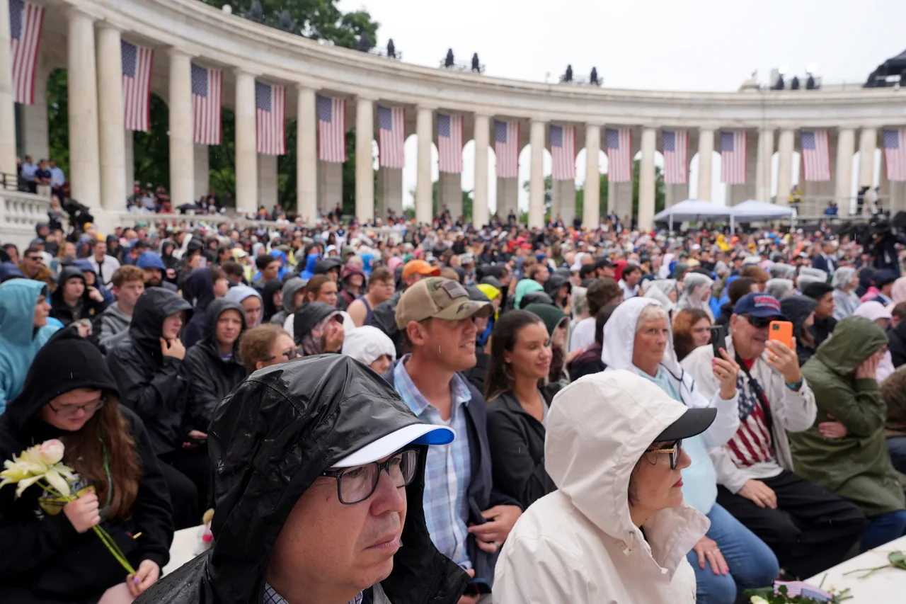 Large crowd gathers outside historic cemetery