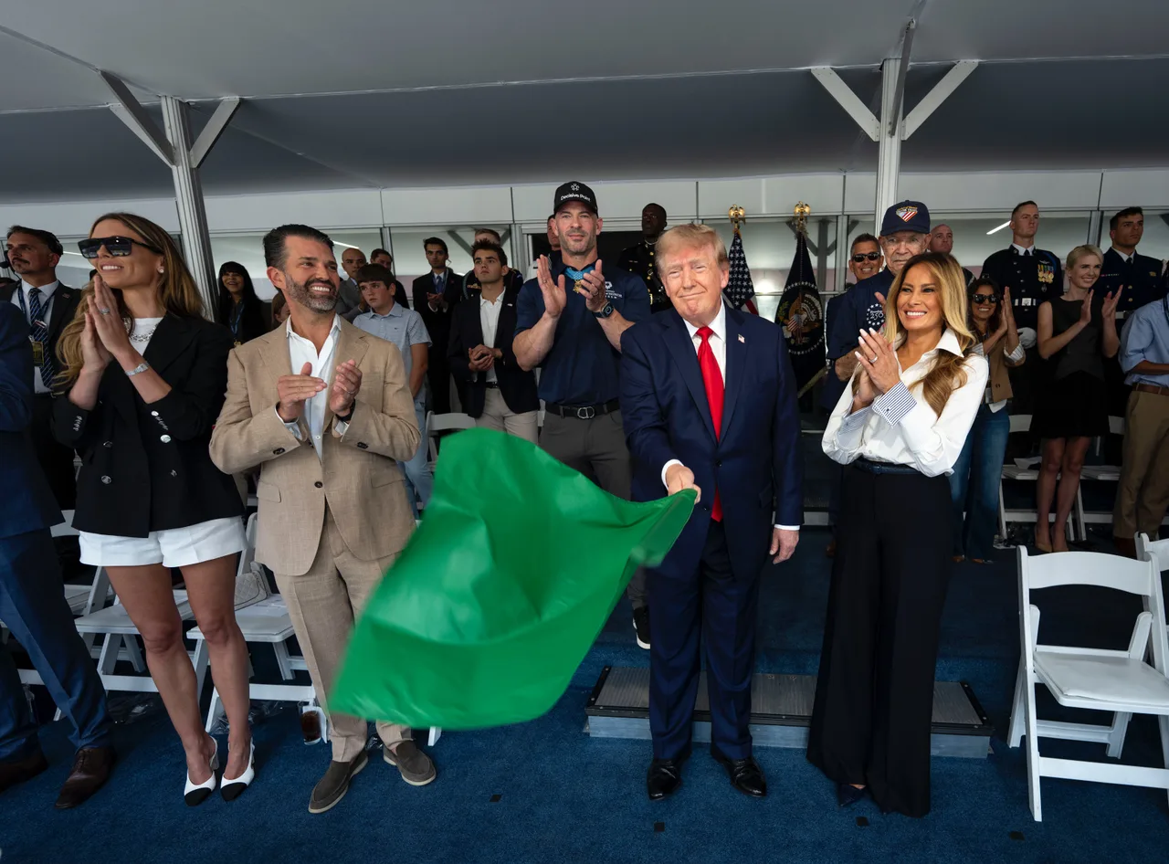 Trump waves green flag with Melania by his side
