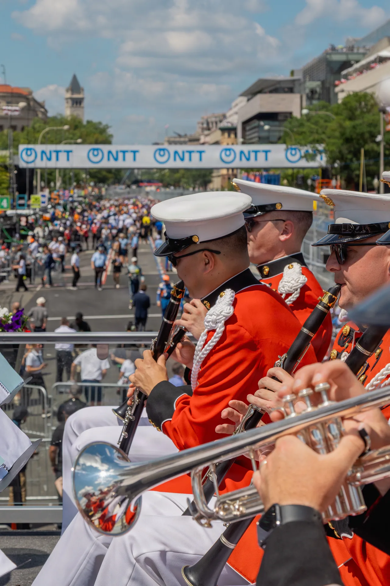 Marine musicians play above the packed racecourse