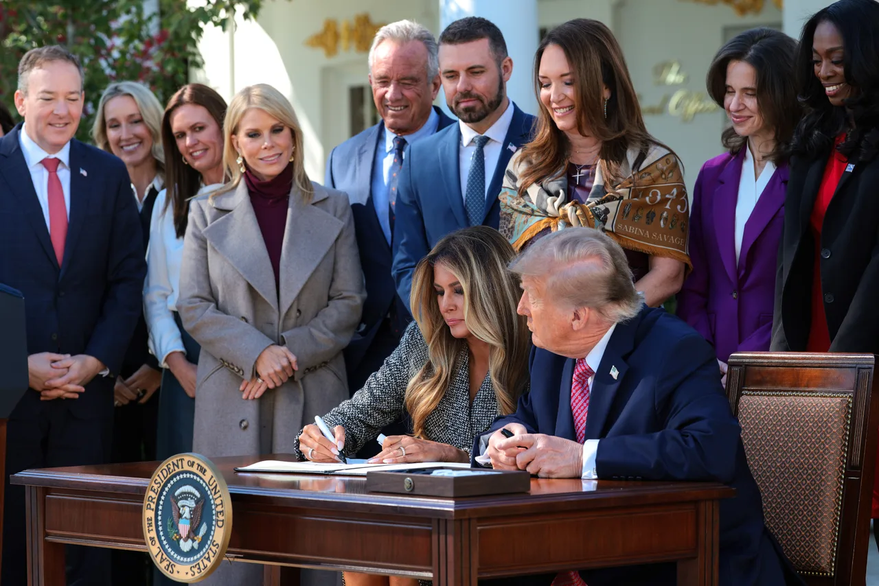 Melania joins Trump for a symbolic signing moment