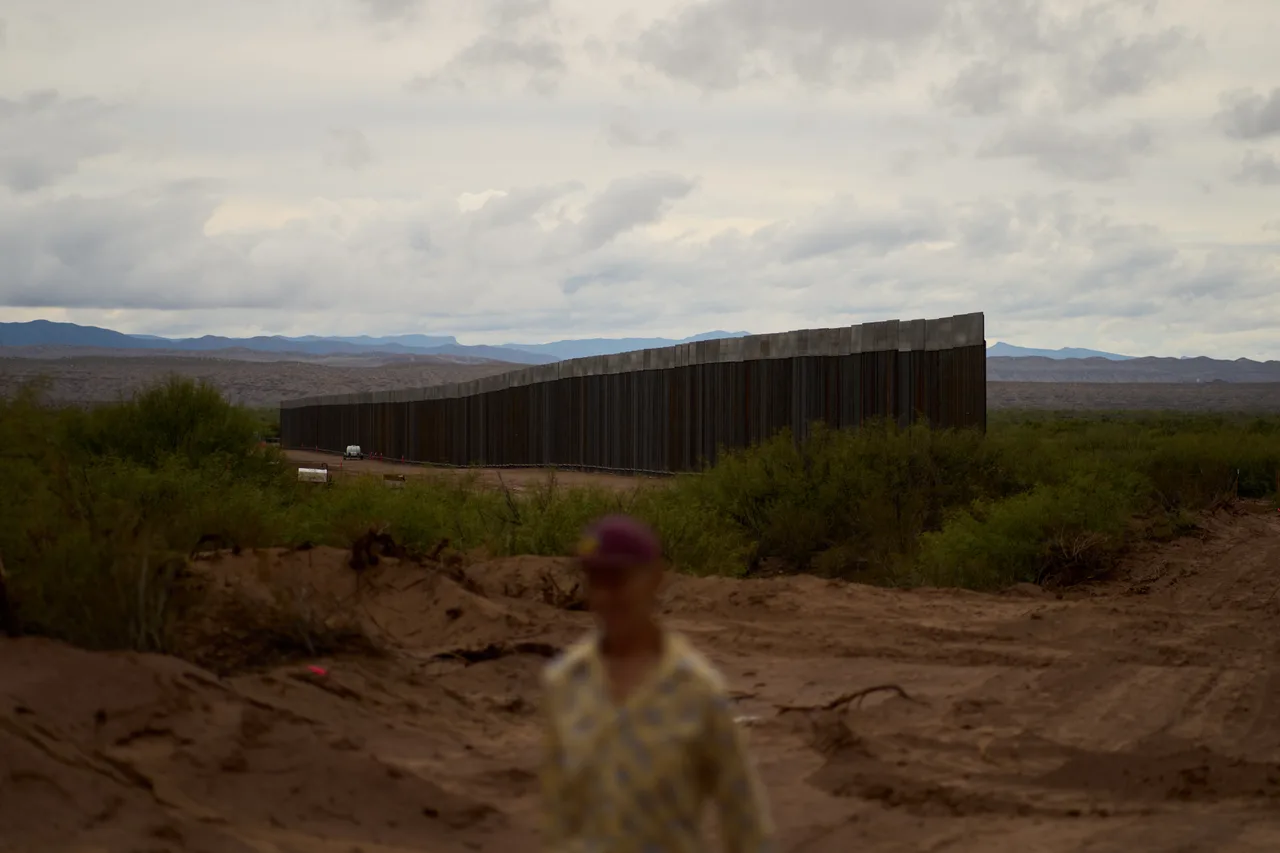 Towering steel panels rise from the desert
