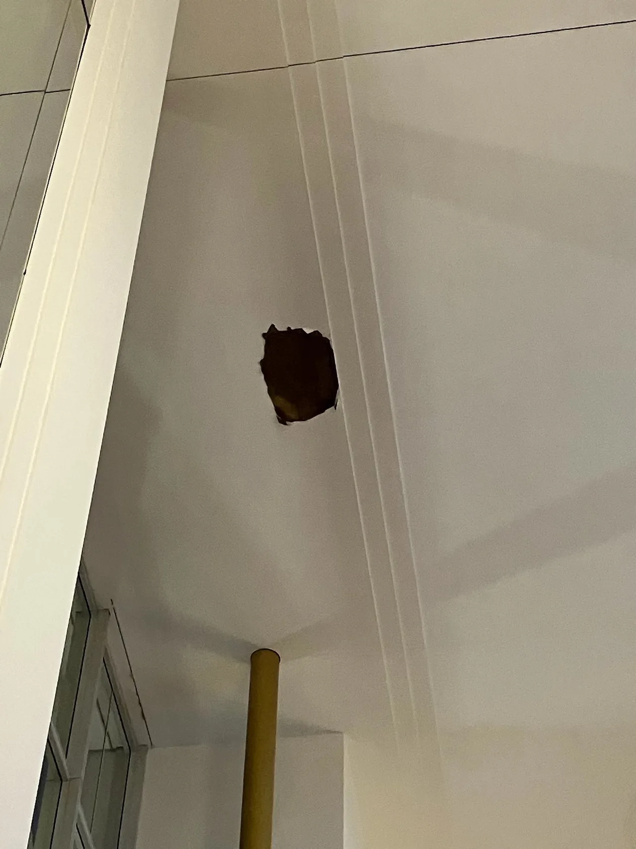 A gaping hole reveals the extent of the damage