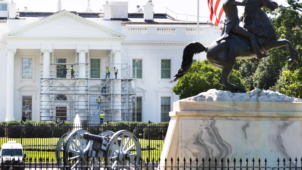 Trump’s White House emerges from months under wraps as workers strip scaffolding to unveil iconic entrance