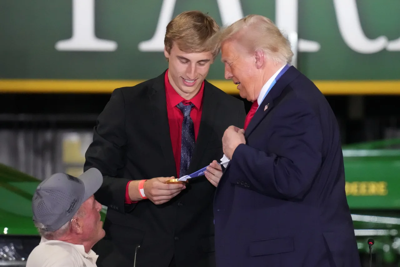 A golden moment as Stolz hands over his medal