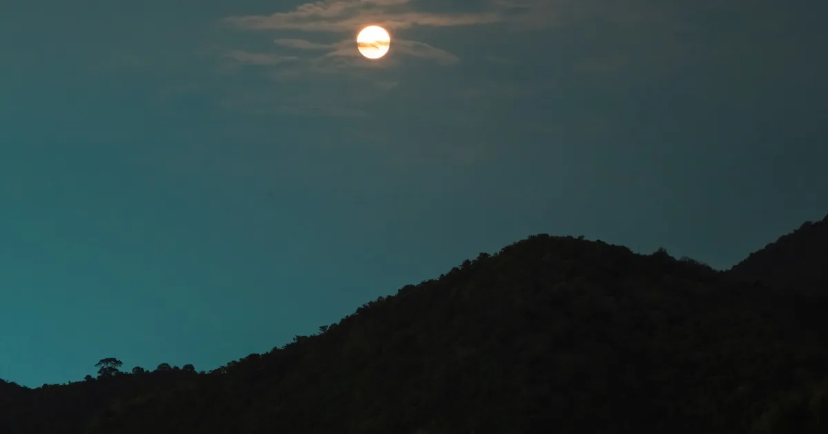 Blue Moon rising over coastal hills of Guangdong Province