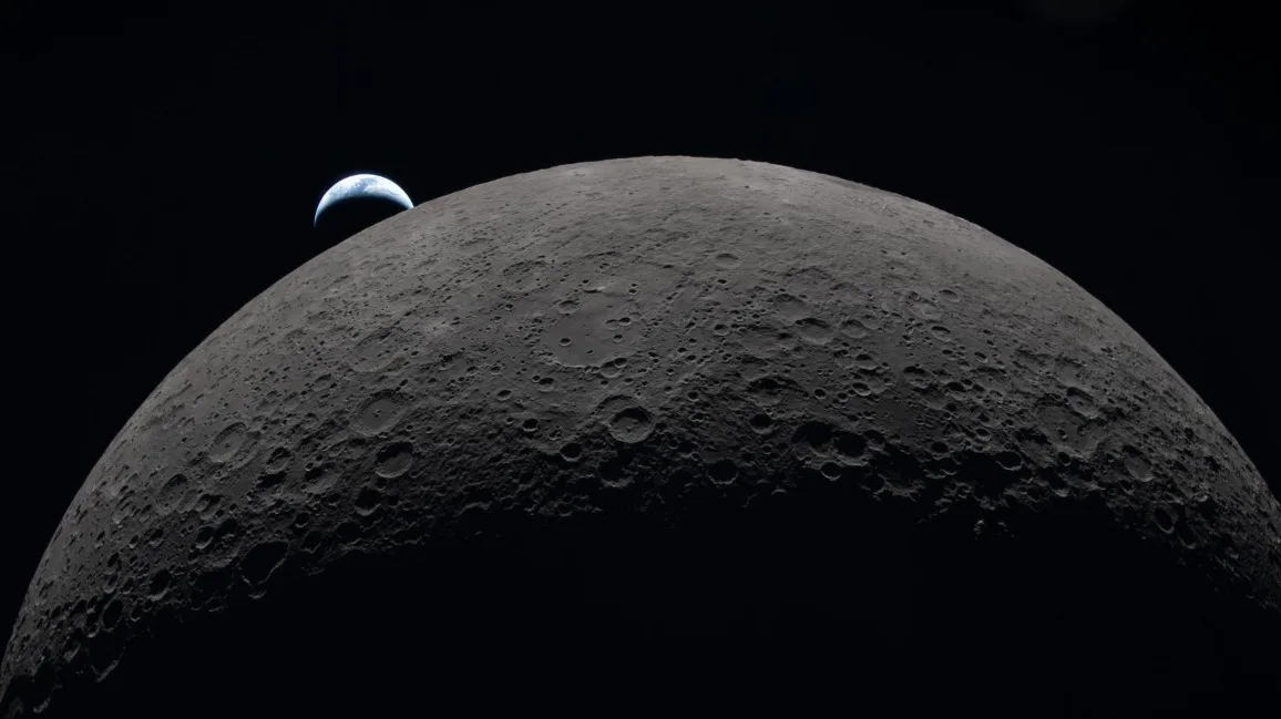 Earth rises beyond the Moon's horizon