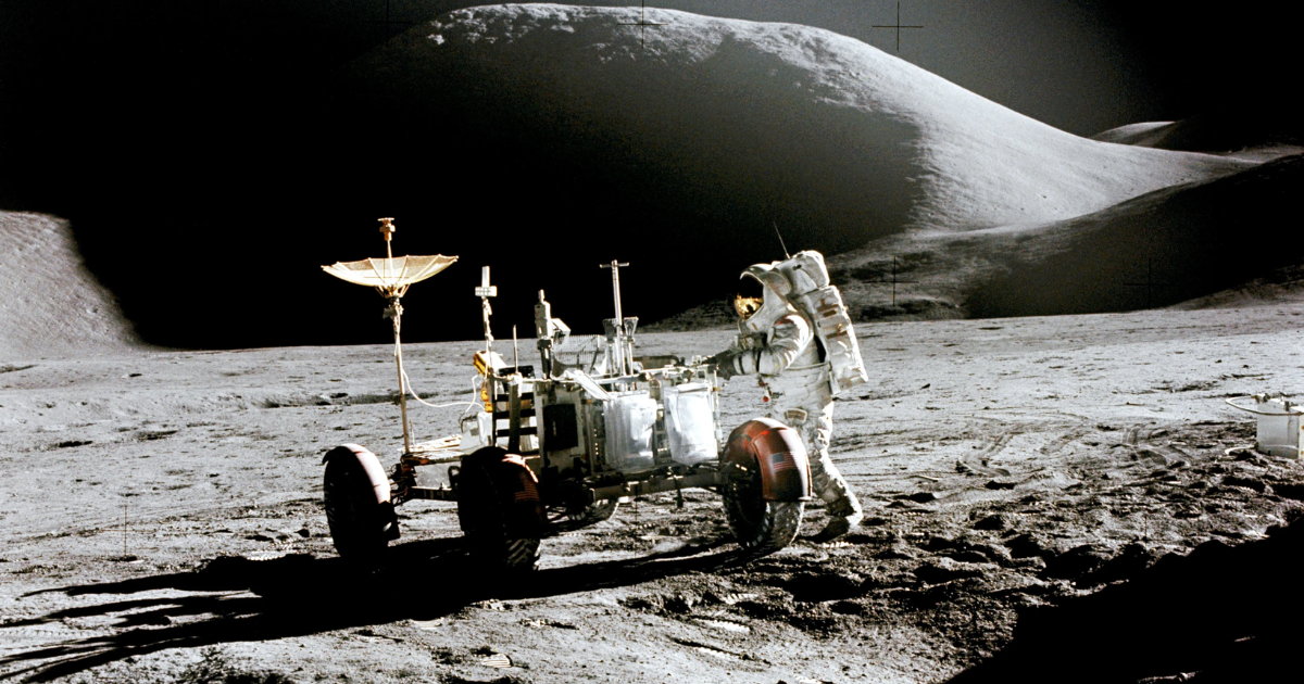 Apollo Astronaut James B. Irwin, lunar module pilot, works at the Lunar Roving Vehicle during the first Apollo 15 lunar surface extravehicular activity (EVA) at the Hadley-Apennine landing site.