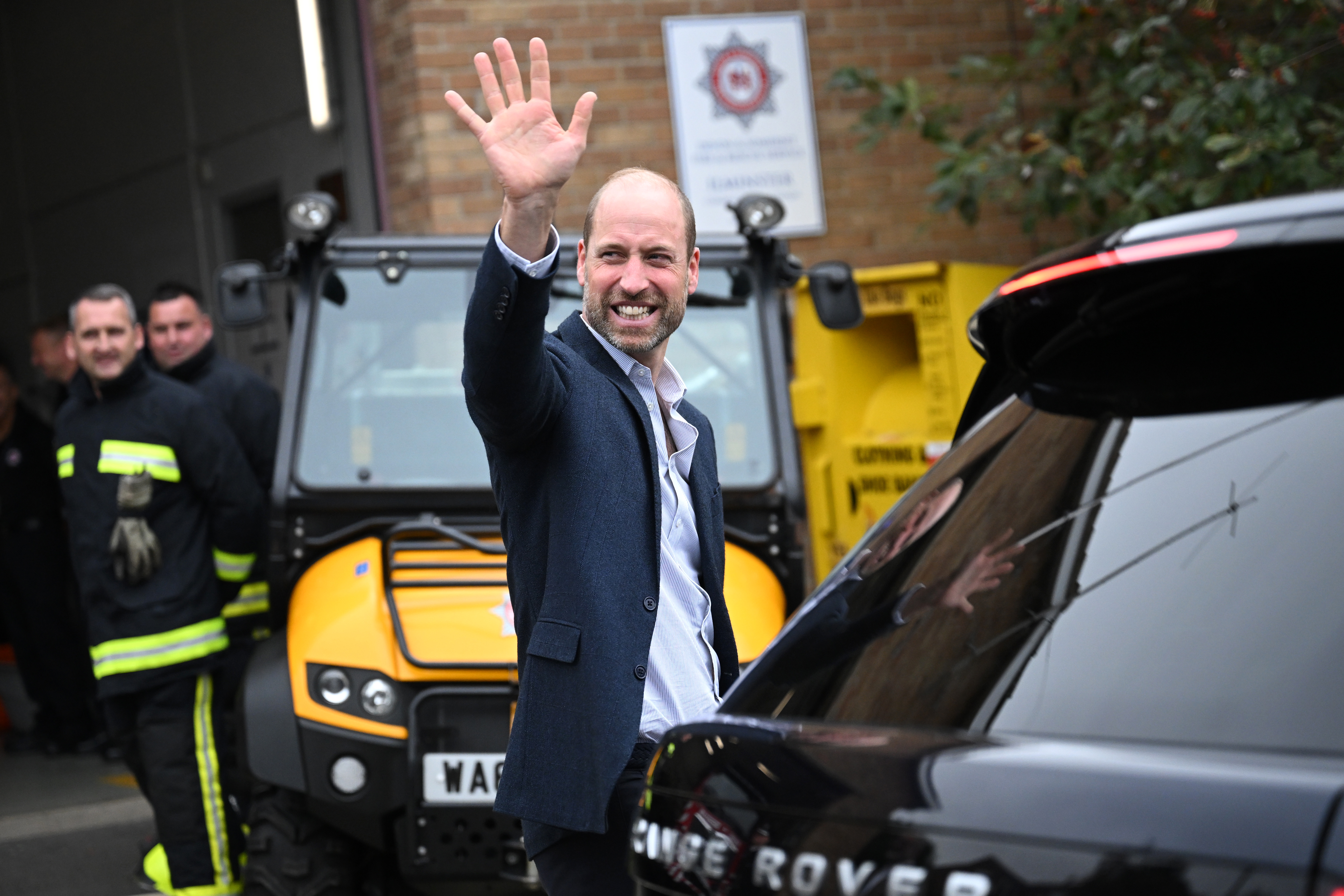Prince William, Prince of Wales, waves to well-wishers during his visit to Ilminster Fire Station on October 06, 2026, in Ilminster, England. (Image Source: Getty Images | Finnbarr Webster)