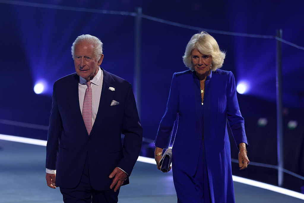 King Charles III and Queen Camilla walk on stage during the opening ceremony ahead of the Glasgow 2026 Commonwealth Games at The Hydro on July 23, 2026 in Glasgow, Scotland.
