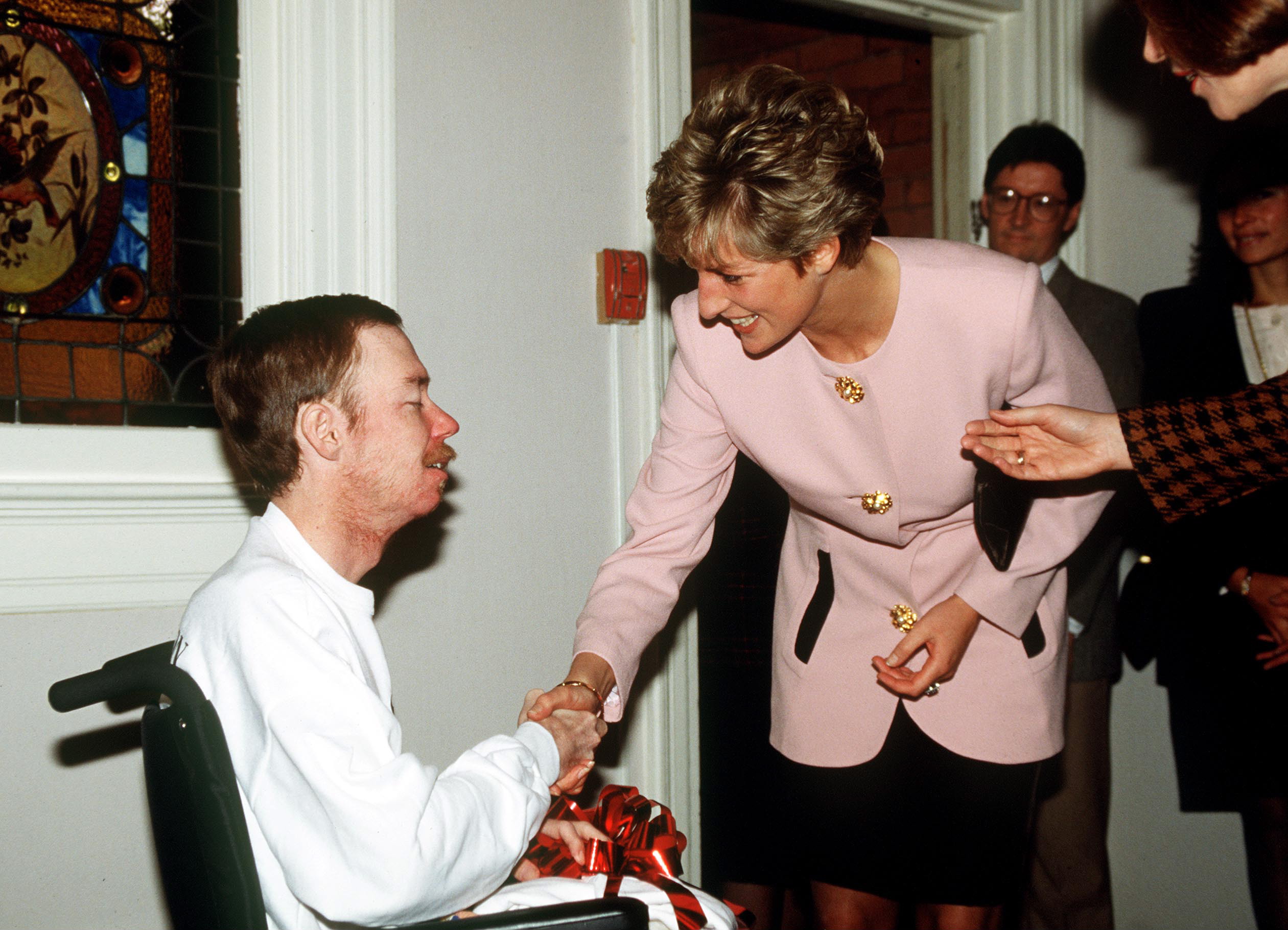 TORONTO, CANADA - OCTOBER 25:  Princess Diana Shaking Hands With One Of The Residents Of Casey House, An Aids Hospice, In Toronto, Canada.  (Photo by Tim Graham Photo Library via Getty Images)