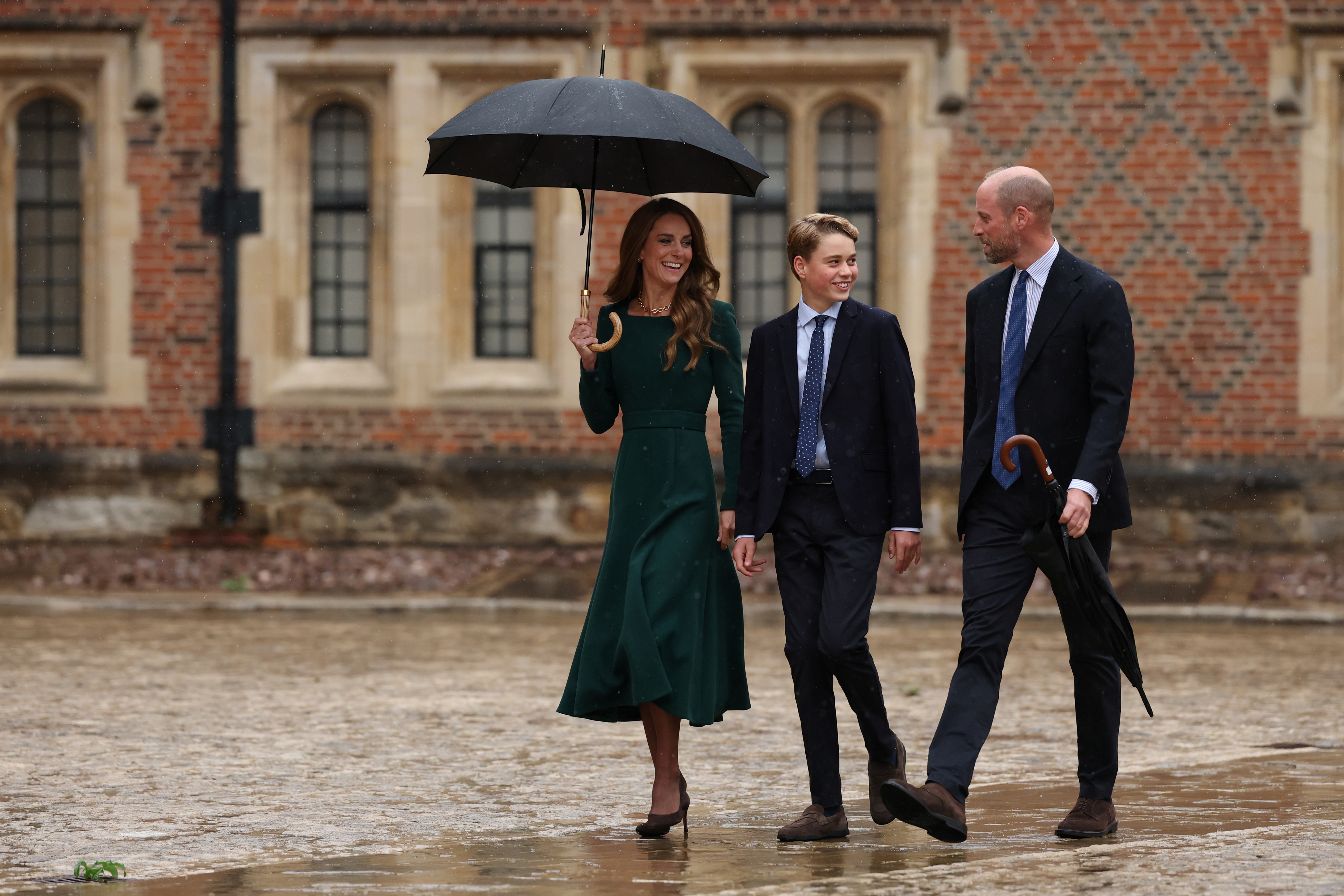 ETON, ENGLAND - SEPTEMBER 8: Catherine, Princess of Wales (L) and Prince William, Prince of Wales (R) walk with their 13-year-old son, Prince George of Wales (C), as he arrives for his first day at Eton College on September 8, 2026 in Berkshire, England. (Photo by Adrian Dennis - WPA Pool/Getty Images)