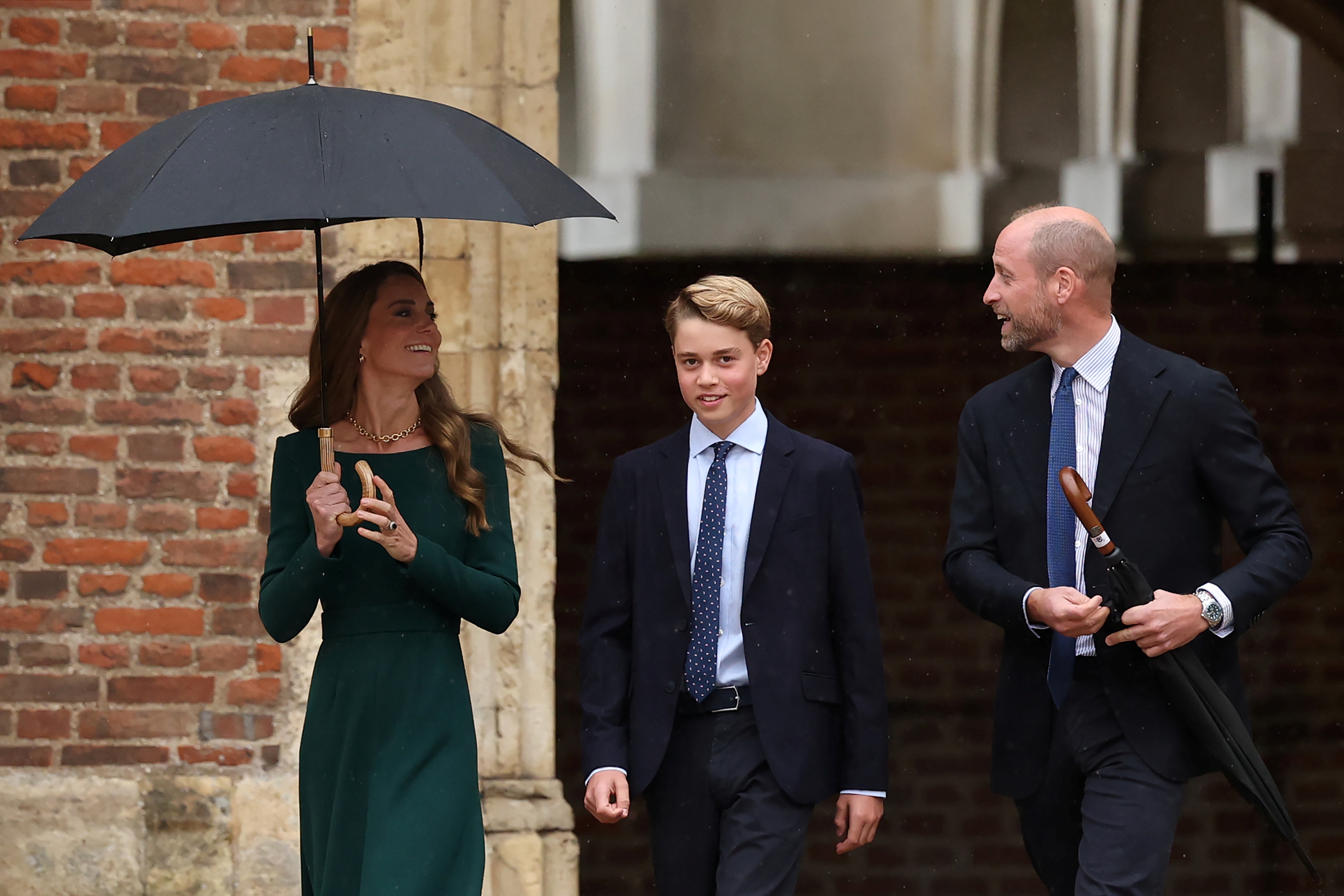 ETON, ENGLAND - SEPTEMBER 8: Catherine, Princess of Wales (L) and Prince William, Prince of Wales (R) walk with their 13-year-old son, Prince George of Wales (C), as he arrives for his first day at Eton College on September 8, 2026 in Berkshire, England. (Photo by Adrian Dennis - WPA Pool/Getty Images)