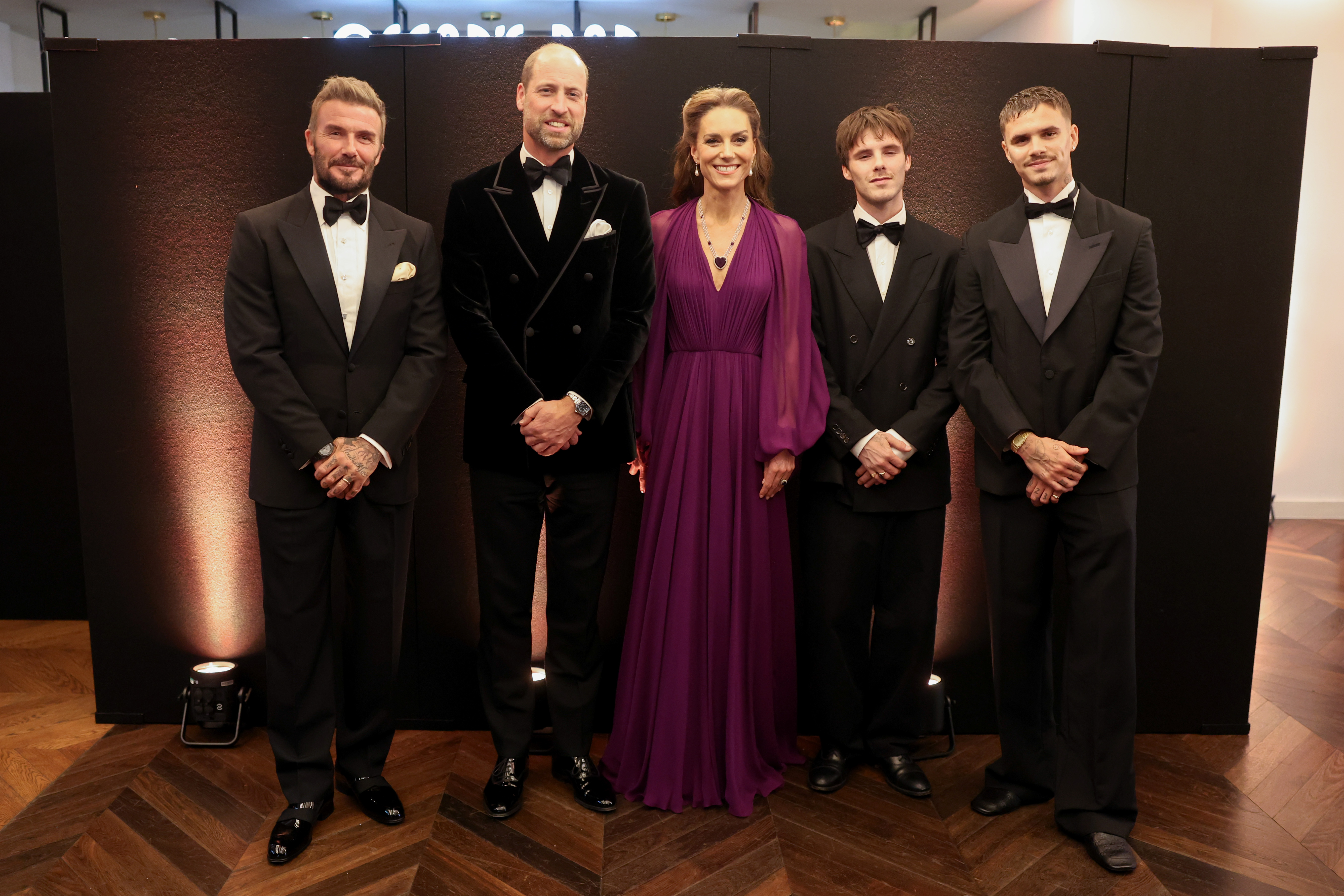 LONDON, ENGLAND - SEPTEMBER 22: (L-R) David Beckham, Prince William, Prince of Wales, Catherine, Princess of Wales, Cruz Beckham and Romeo Beckham attend the