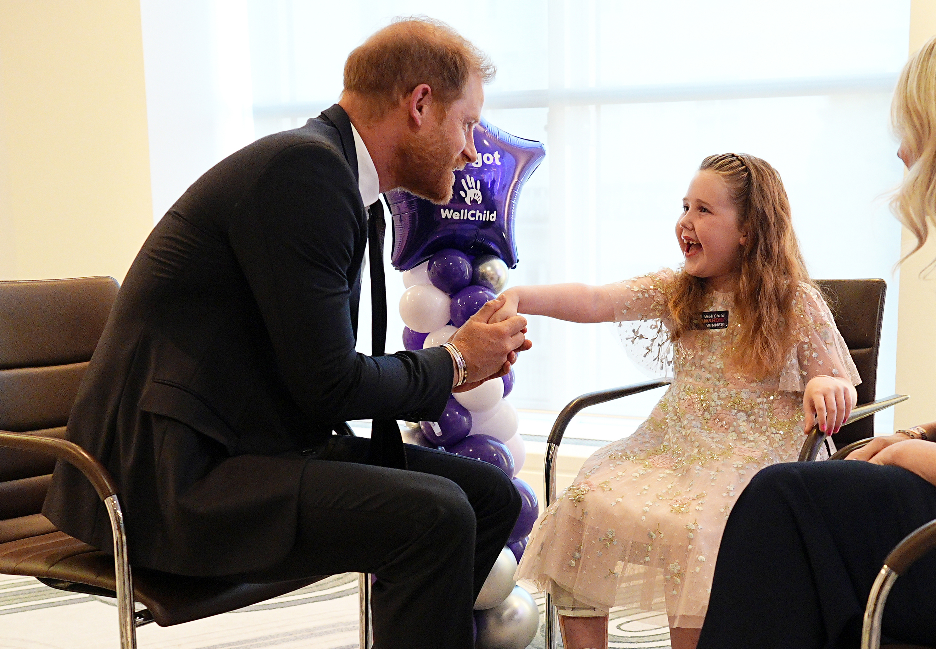 LONDON, ENGLAND - SEPTEMBER 21: Prince Harry, Duke of Sussex (L) meets with winner of the Inspirational Child 4-6, Margot Jones-Billington (C) during the 2026 Wellchild Awards at the Royal Lancaster Hotel on September 21, 2026 in London, England. (Photo by Aaron Chown - Pool/Getty Images)