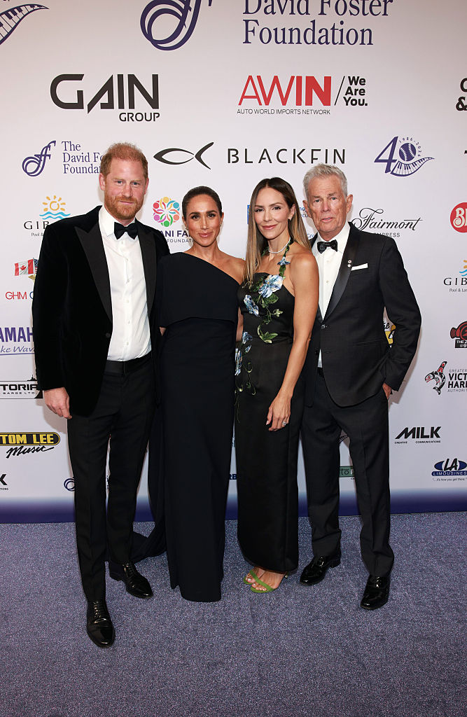 (L-R) Prince Harry, Duke of Sussex, Meghan, Duchess of Sussex, Katharine McPhee and David Foster attend the David Foster Foundation 40th Anniversary Celebration. (Image Source: Getty Images | Vito Amati/The David Foster Foundation)