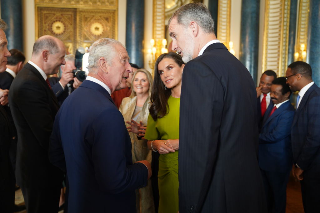 King Charles speaks to King Felipe VI and Queen Letizia of Spain, during a reception at Buckingham Palace for overseas guests attending his coronation on May 5, 2023, in London, England. (Image Source: Getty Images I Jacob King - WPA Pool)