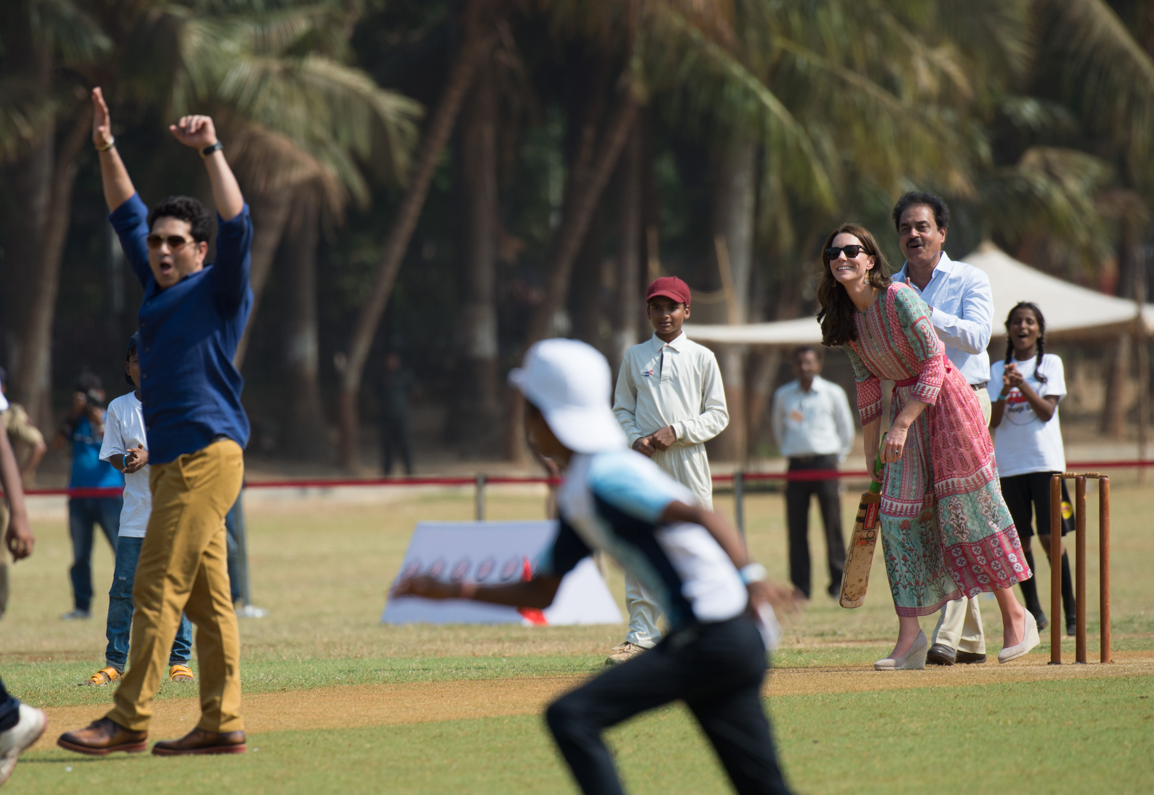 Sachin Tendulkar and Kate Middleton take part in a game of cricket as she visits the Oval Maidan to meet children from Magic Bus, Childlike, and Doorstep during the royal visit to India and Bhutan in 2016 in Mumbai, India (Image Source: Getty Images | Zak Hussein/Corbis)