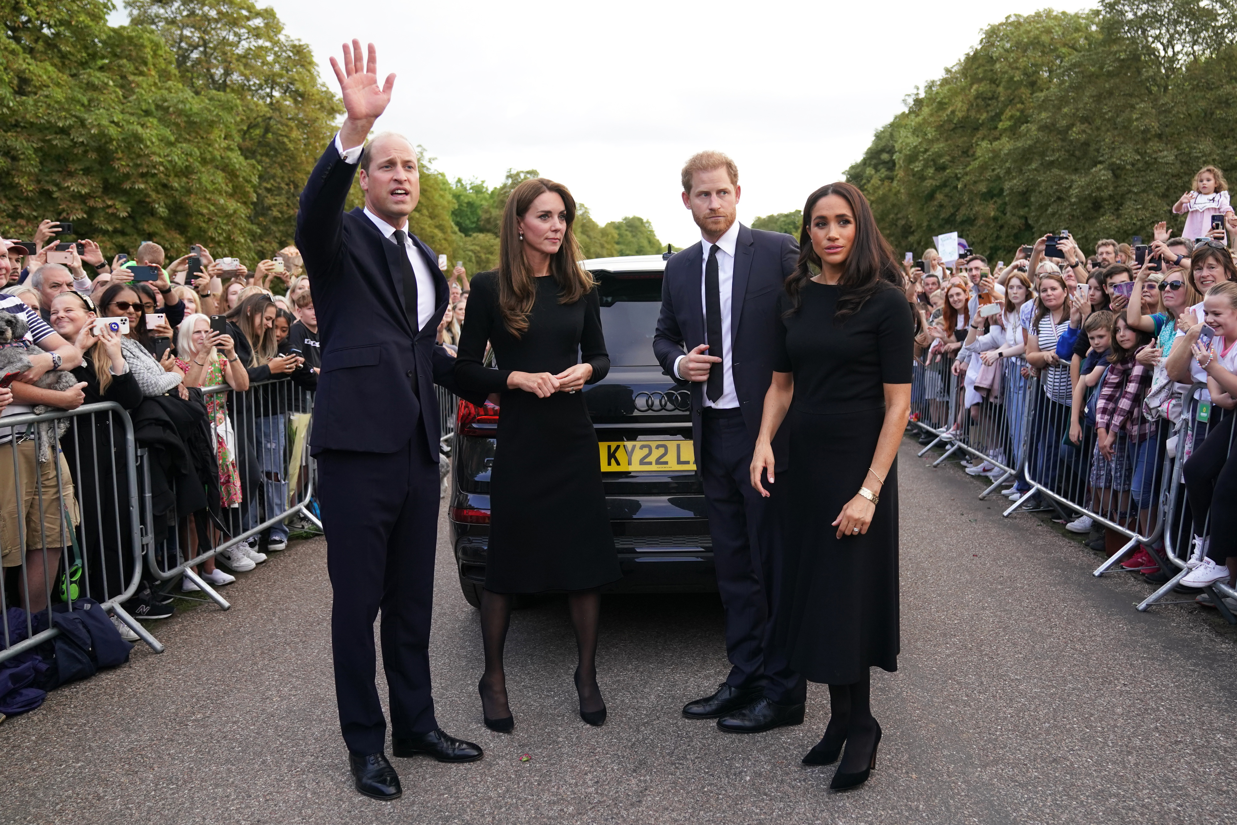 WINDSOR, ENGLAND - SEPTEMBER 10: Catherine, Princess of Wales, Prince William, Prince of Wales, Prince Harry, Duke of Sussex, and Meghan, Duchess of Sussex meet members of the public on the long Walk at Windsor Castle on September 10, 2022 in Windsor, England. Crowds have gathered and tributes left at the gates of Windsor Castle to Queen Elizabeth II, who died at Balmoral Castle on 8 September, 2022. (Photo by Kirsty O'Connor - WPA Pool/Getty Images)