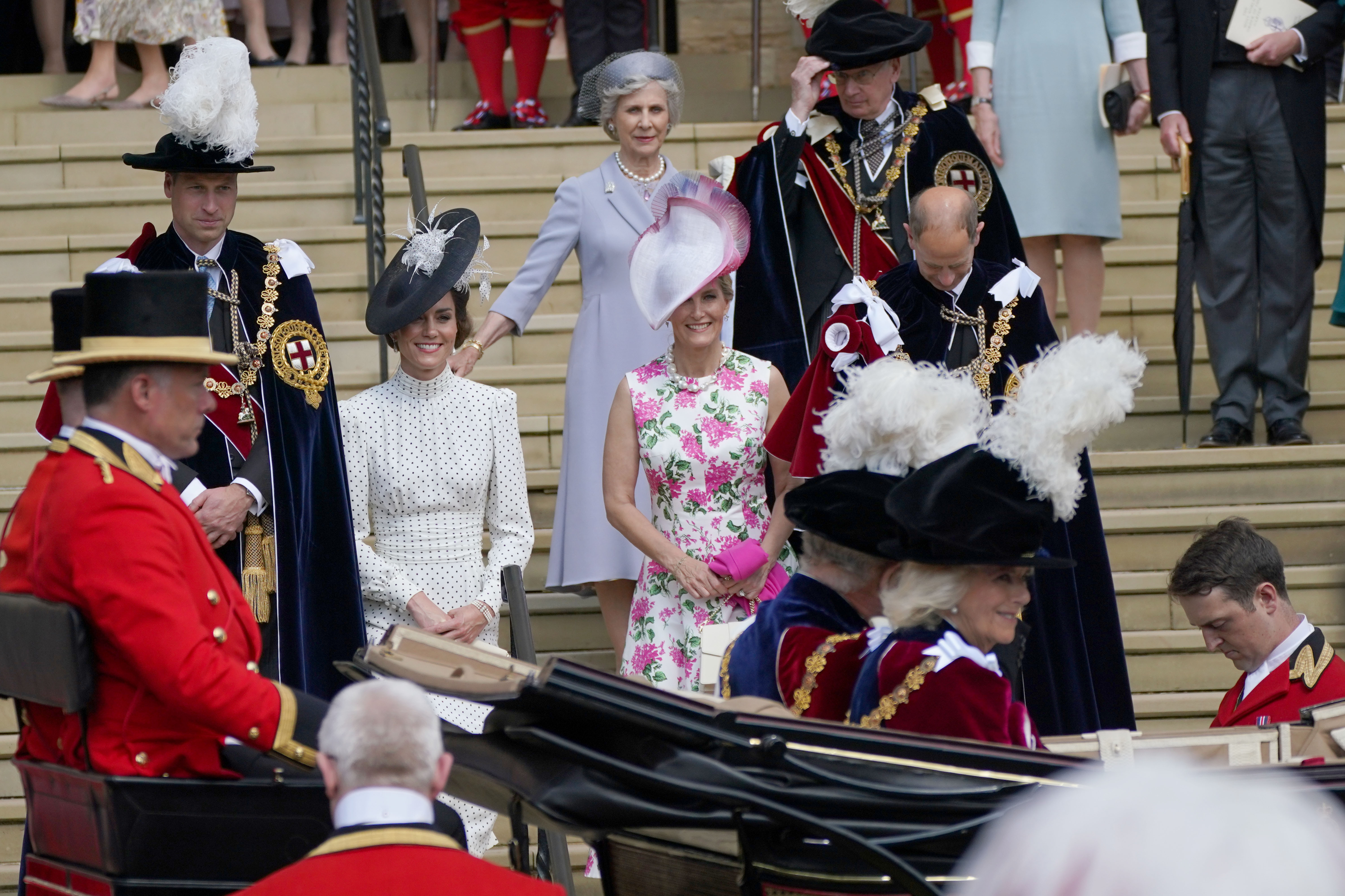 WINDSOR, ENGLAND - JUNE 19: (L-R) Prince William, Prince of Wales, Catherine, Princess of Wales, Sophie, Duchess of Edinburgh and Prince Edward, Duke of Edinburgh watch as King Charles and Queen Camilla depart after the Order Of The Garter Service at Windsor Castle on June 19, 2023 in Windsor, England. The Order of the Garter is the oldest and most senior Order of Chivalry in Britain. Knights of the Garter are chosen personally by the Sovereign to honour those who have held public office, contributed in a particular way to national life or who have served the Sovereign personally. During the service, the Baroness Ashton of Upholland GCMG will be installed as a Lady Companion of the Most Noble Order of the Garter, and the Lord Patten of Barnes CH will be installed as a Knight Companion of the Most Noble Order of the Garter. (Photo by Yui Mok-WPA Pool/Getty Images)