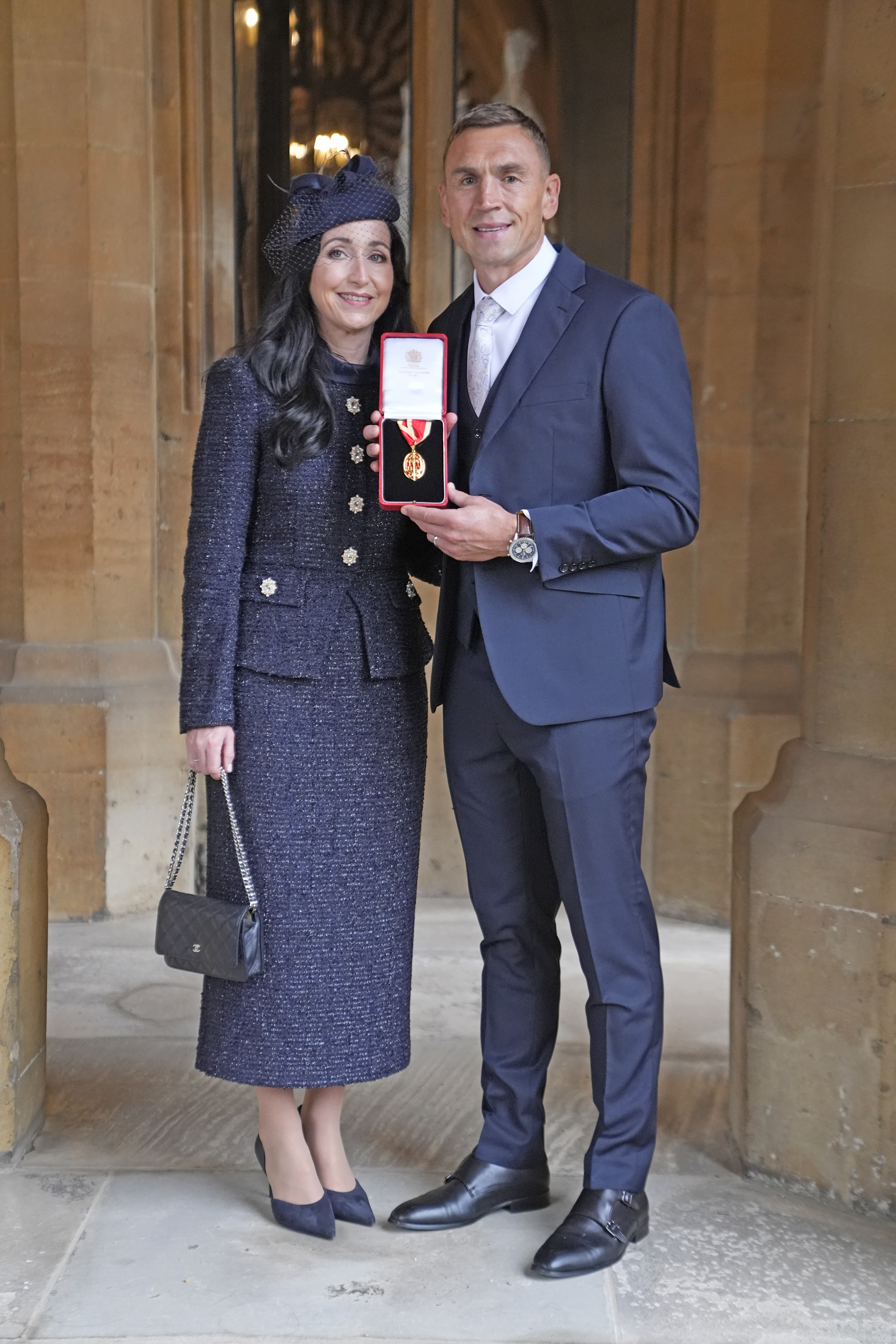 Sir Kevin Sinfield, with his wife Jayne Sinfield, after he was made a Knight Bachelor at an investiture ceremony at Windsor Castle on October 7, 2026, in Windsor, England. (Image Source: Getty Images | Andrew Matthews - Pool)