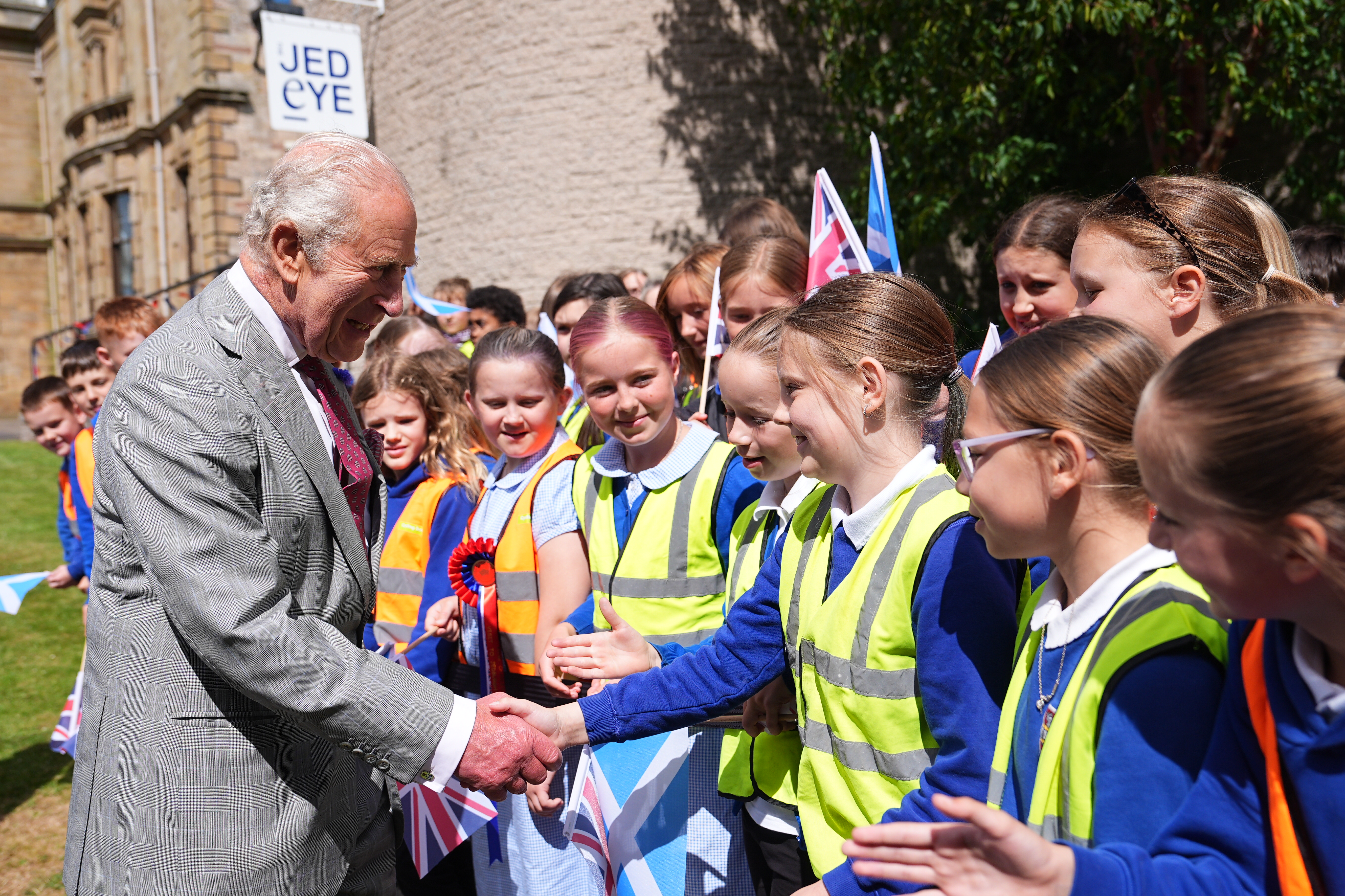 JEDBURGH, SCOTLAND - JULY 2: King Charles III meets children during his visit to Jedburgh in the Scottish Borders, as part of the King's visit to Scotland for Holyrood Week on July 02, 2026 in Jedburgh, Scotland. King Charles III and Queen Camilla are visiting Scotland with members of the Royal Family for their annual Royal Week from Tuesday, June 30 until Friday, July 03. (Photo by Aaron Chown - WPA Pool/Getty Images)