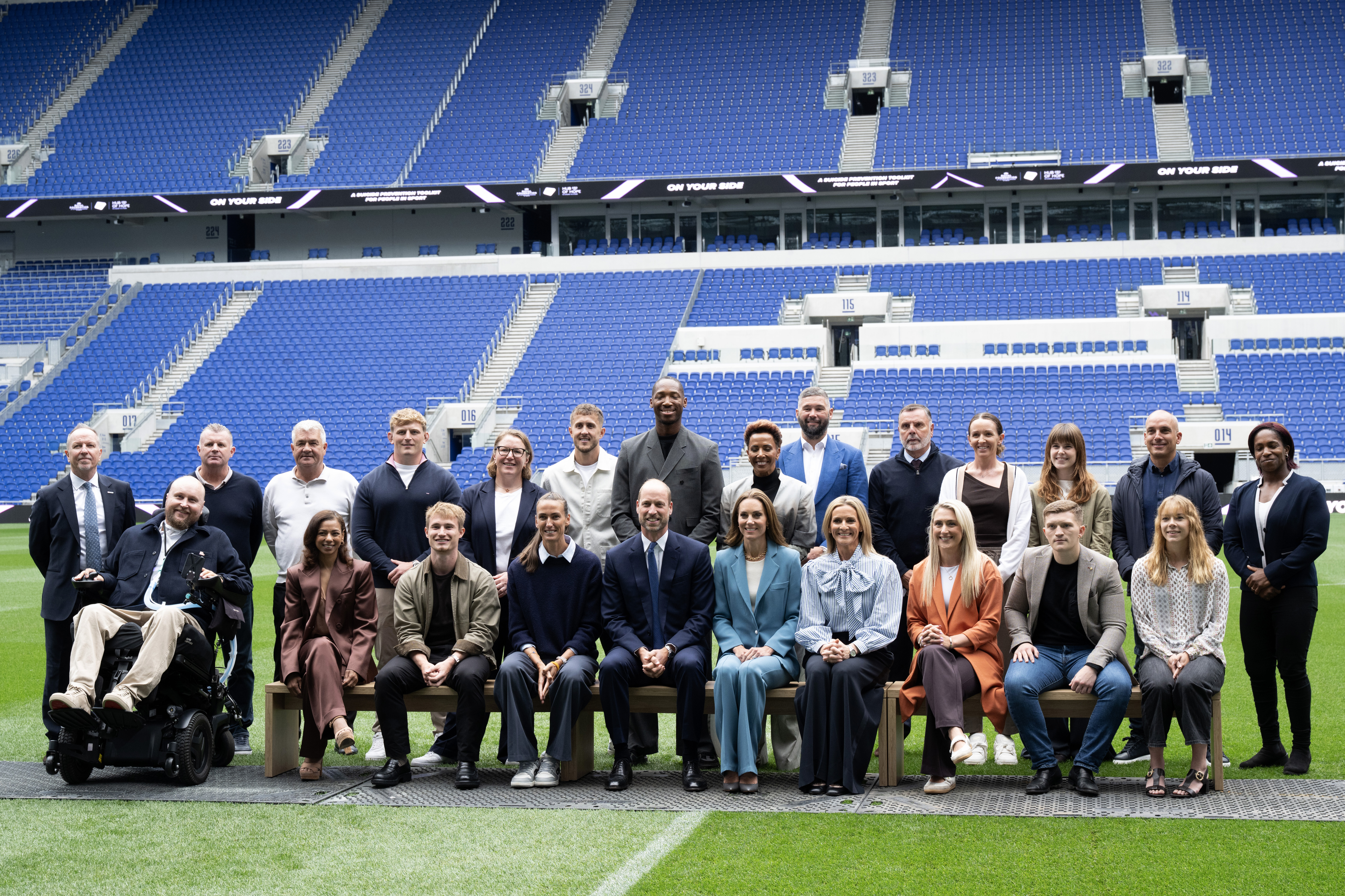 Kate Middleton and Prince William pose for a group photo during the launch of a Suicide Prevention Toolkit on World Suicide Prevention Day at Hill Dickinson Stadium in Liverpool, England (Image Source: Getty Images | Shirlaine Forrest)