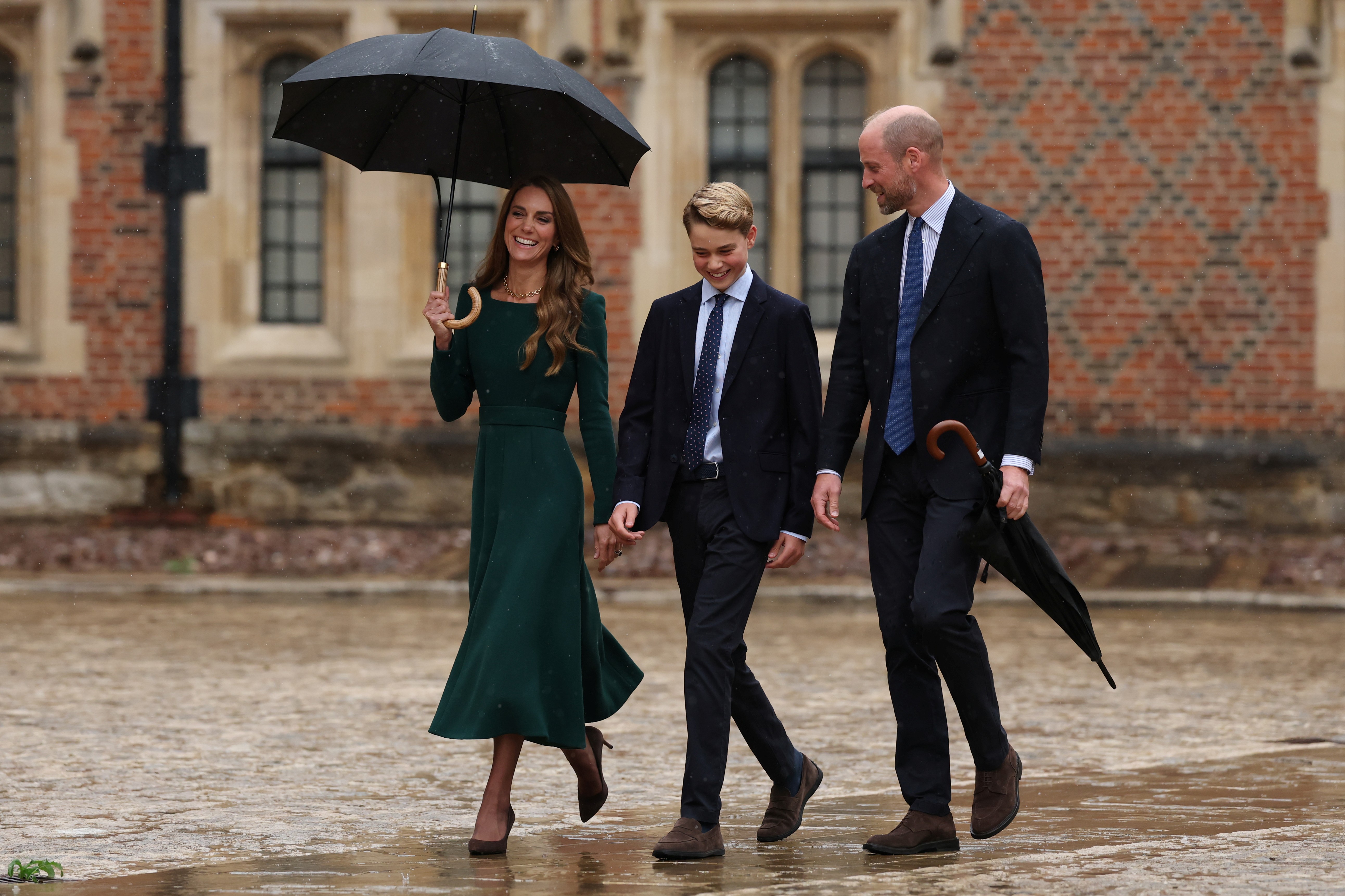 ETON, ENGLAND - SEPTEMBER 8: Catherine, Princess of Wales (L) and Prince William, Prince of Wales (R) walk with their 13-year-old son, Prince George of Wales (C), as he arrives for his first day at Eton College on September 8, 2026 in Berkshire, England. (Photo by Adrian Dennis - WPA Pool/Getty Images)