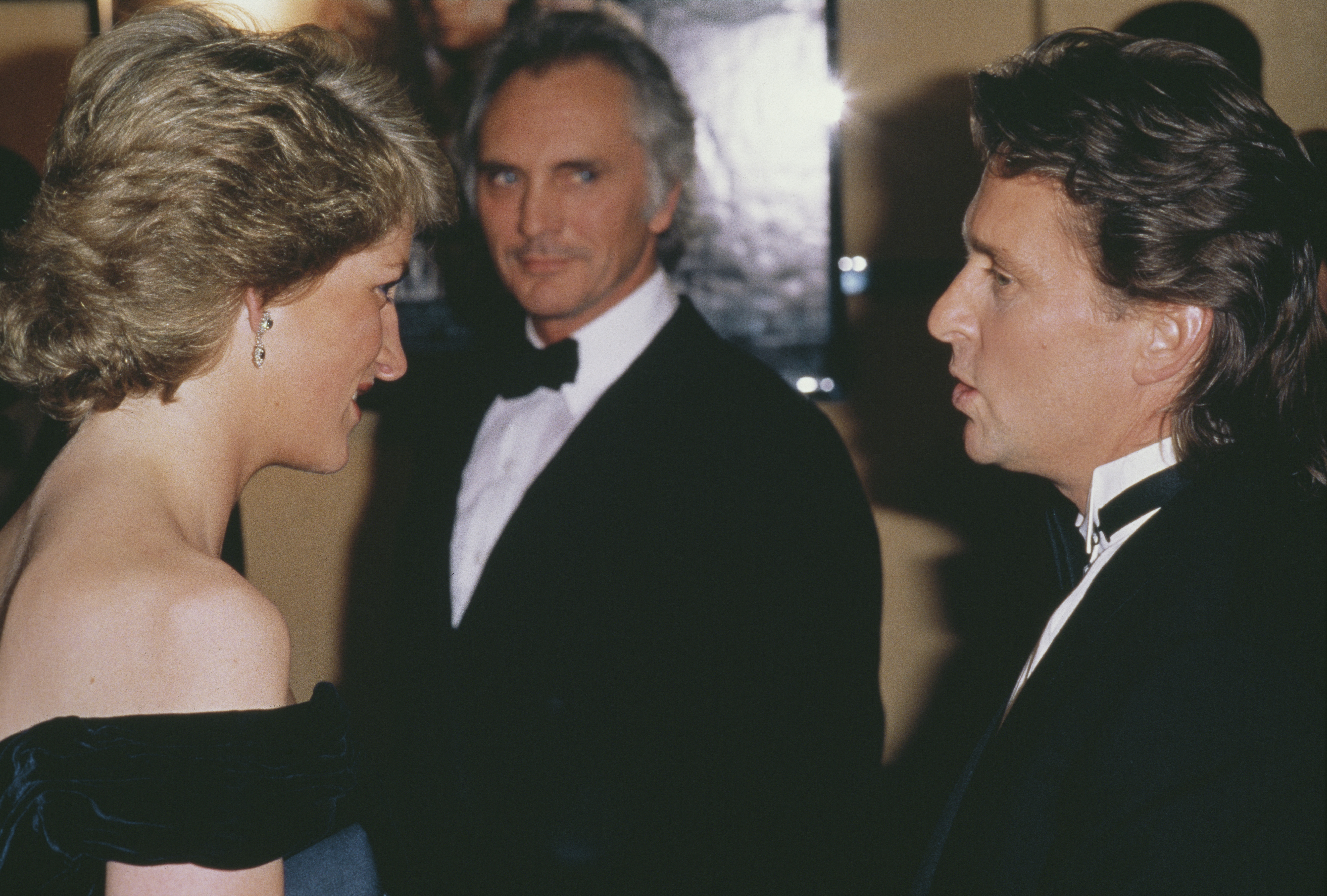 Diana, Princess of Wales talking to Michael Douglas at the London premiere of the film 'Wall Street', 28th April 1988. (Cover Image Source: Getty Images | Princess Diana Archive)