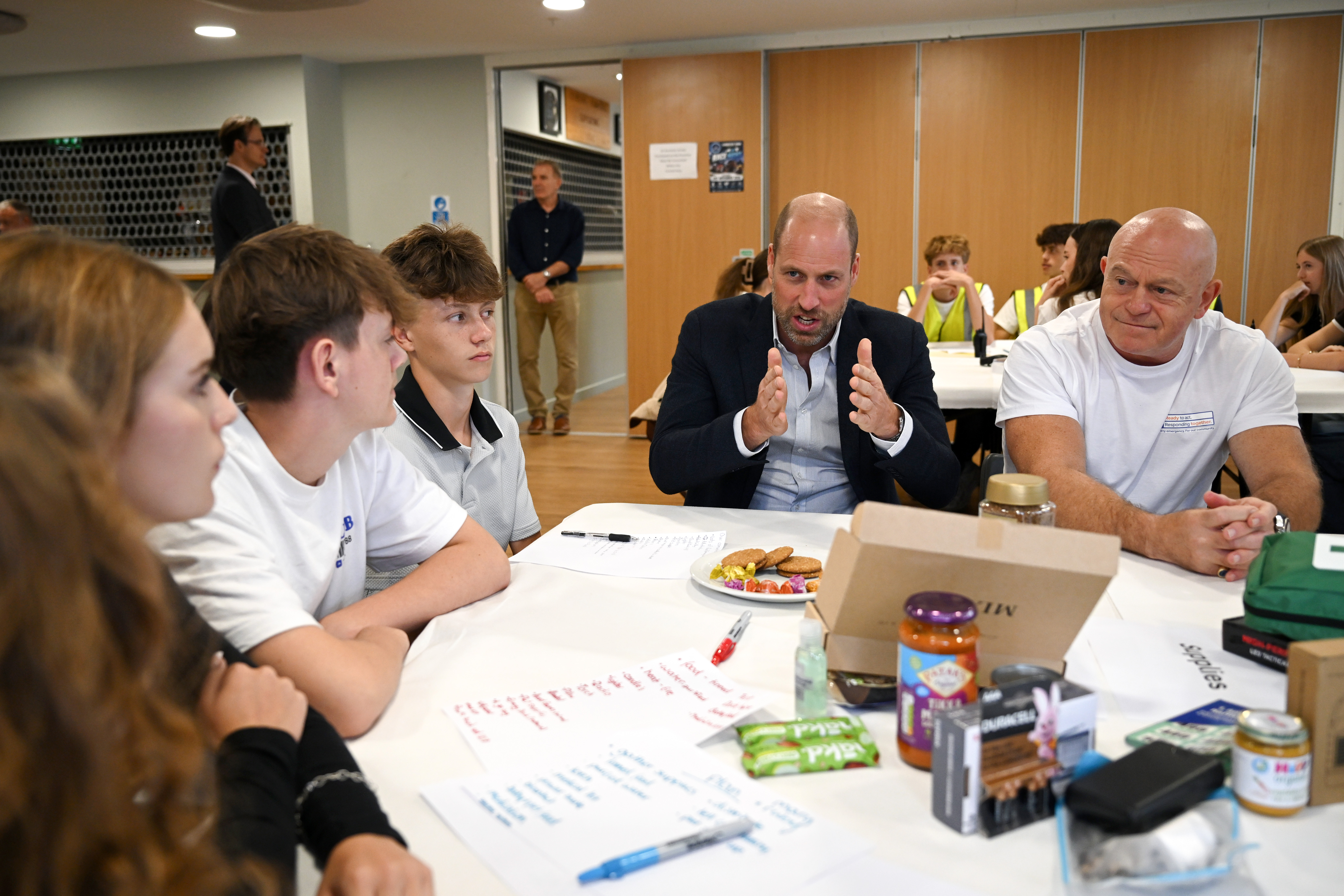 Prince William, Prince of Wales and Ross Kemp take part in a training exercise during his visit to the launch of the National Emergency Trust's