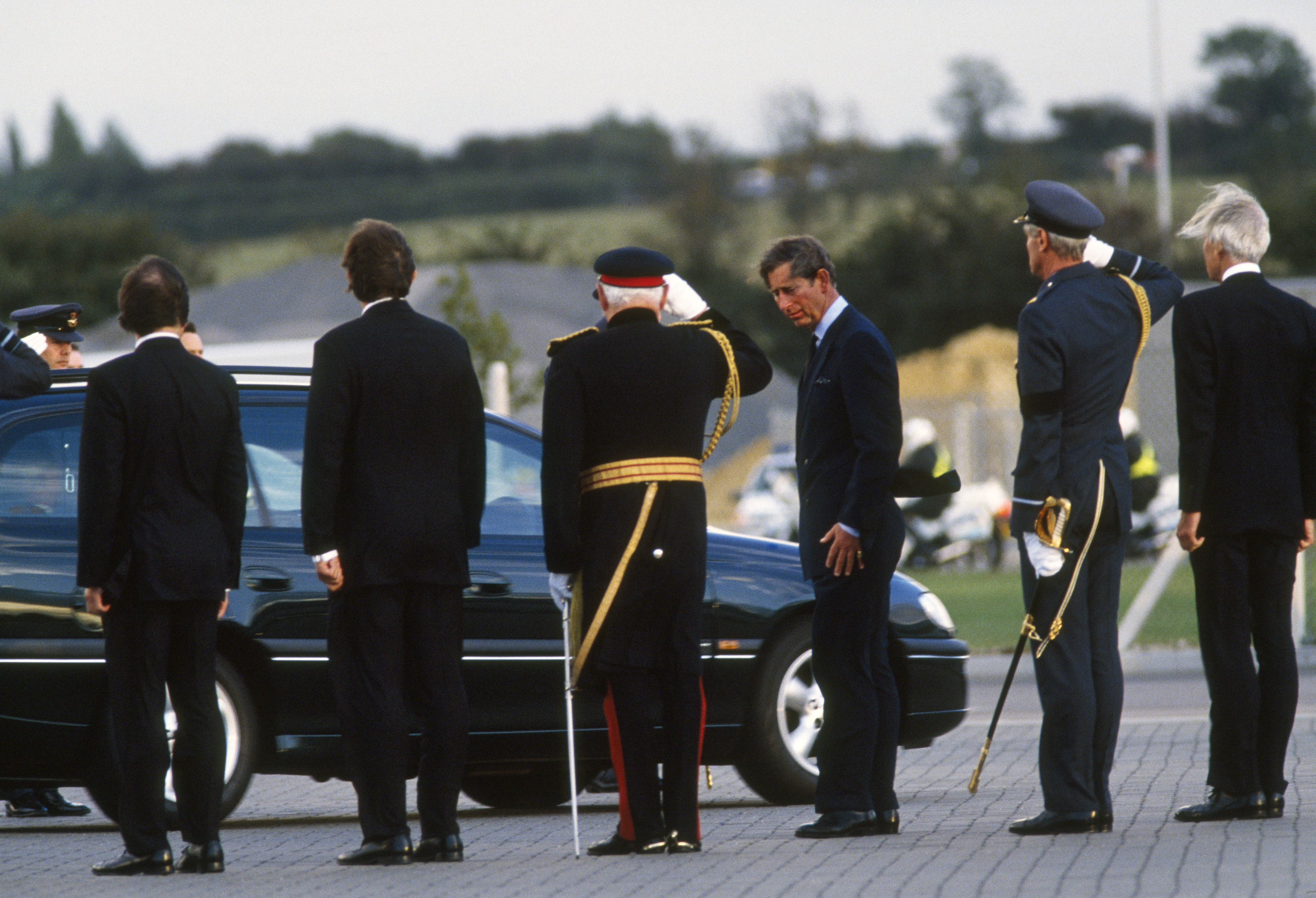 NORTHOLT, UNITED KINGDOM - AUGUST 31 1997: Britain's Prince Charles at RAF Northolt Airport near London 31 AUG. following the arrival of the coffin containing the body of his former wife Diana, Princess of Wales who died in an horrific car crash in Paris in the early hours of this morning.