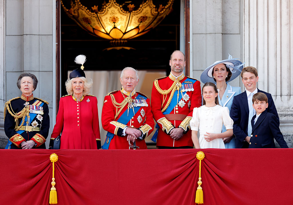 Princess Anne, Queen Camilla, King Charles III, Prince William, Kate Middleton, Princess Charlotte, Prince George, and Prince Louis  watch an RAF flypast from the balcony of Buckingham Palace after attending Trooping the Colour 2026 (Image Source: Getty Images I Max Mumby/Indigo)