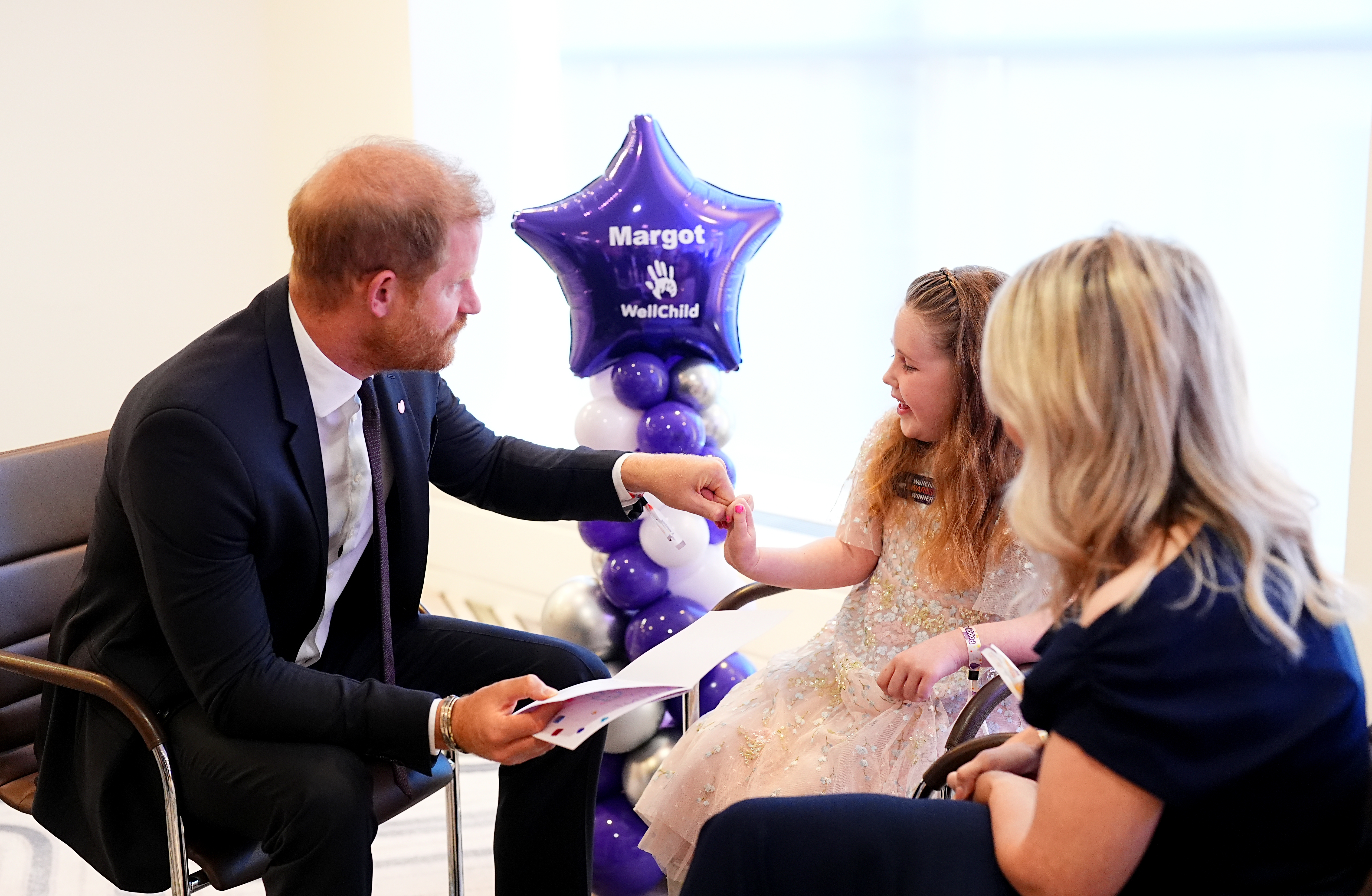LONDON, ENGLAND - SEPTEMBER 21: Prince Harry, Duke of Sussex (L) meets with winner of the Inspirational Child 4-6, Margot Jones-Billington (C) during the 2026 Wellchild Awards at the Royal Lancaster Hotel on September 21, 2026 in London, England. (Photo by Aaron Chown - Pool/Getty Images)