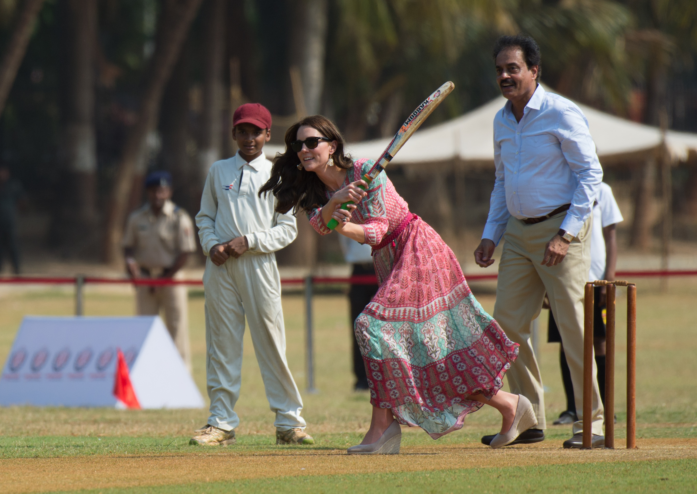 Kate Middleton takes part in a game of cricket as she visits the Oval Maidan to meet children from Magic Bus, Childlike, and Doorstep during the royal visit to India and Bhutan in 2016 in Mumbai, India (Image Source: Getty Images | Zak Hussein/Corbis)