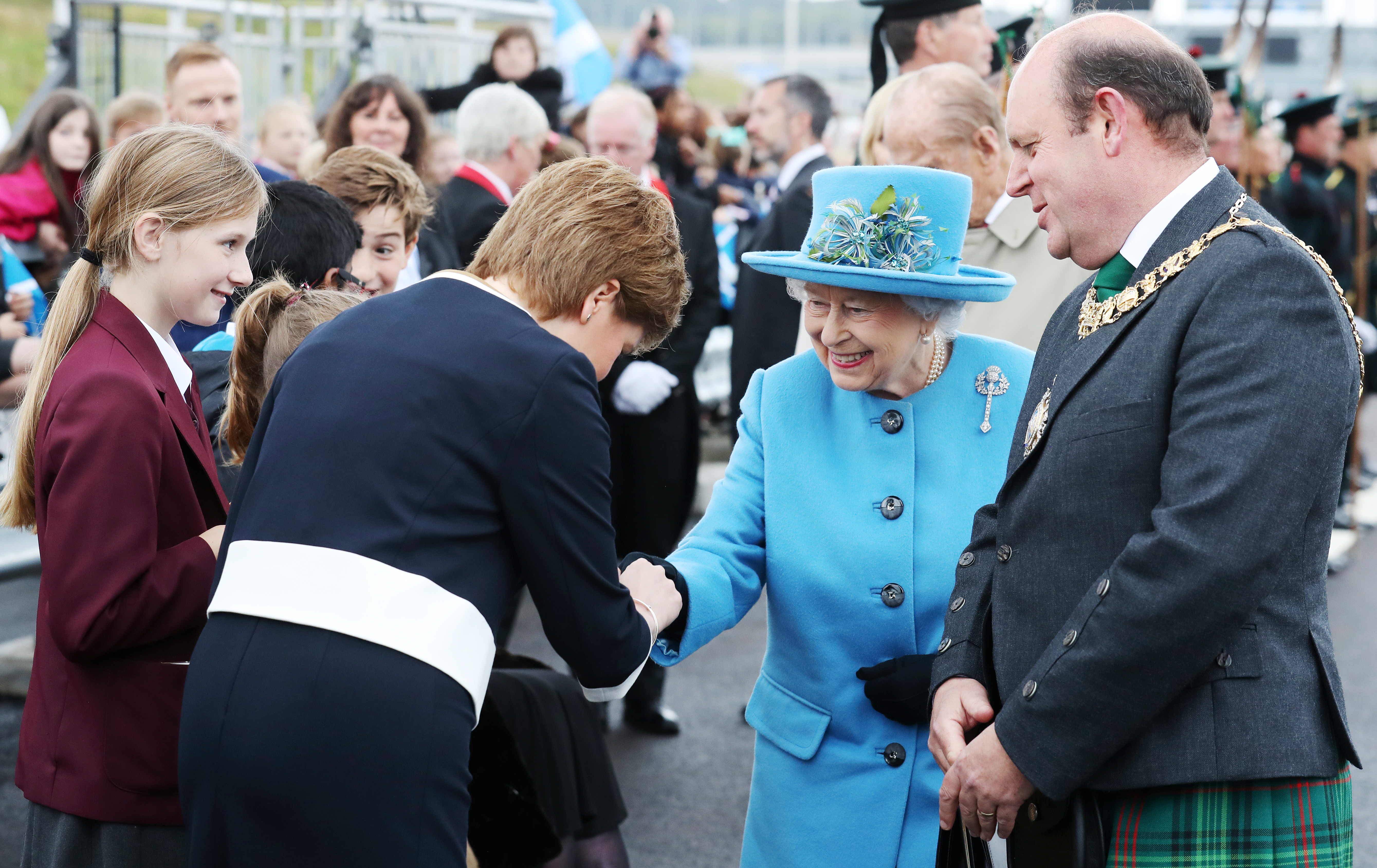 SOUTH QUEENSFERRY, SCOTLAND - SEPTEMBER 04:  Queen Elizabeth II is greeted by First Minister Nicola Sturgeon during the official opening ceremony of the Queensferry Crossing, on September 4, 2017 in South Queensferry, Scotland. Scotland's newest road bridge which began construction in 2011, crosses the Firth of Forth near Edinburgh. The crossing is the world's longest three tower cable stayed bridge.  (Photo by Andrew Milligan - WPA Pool/Getty Images)