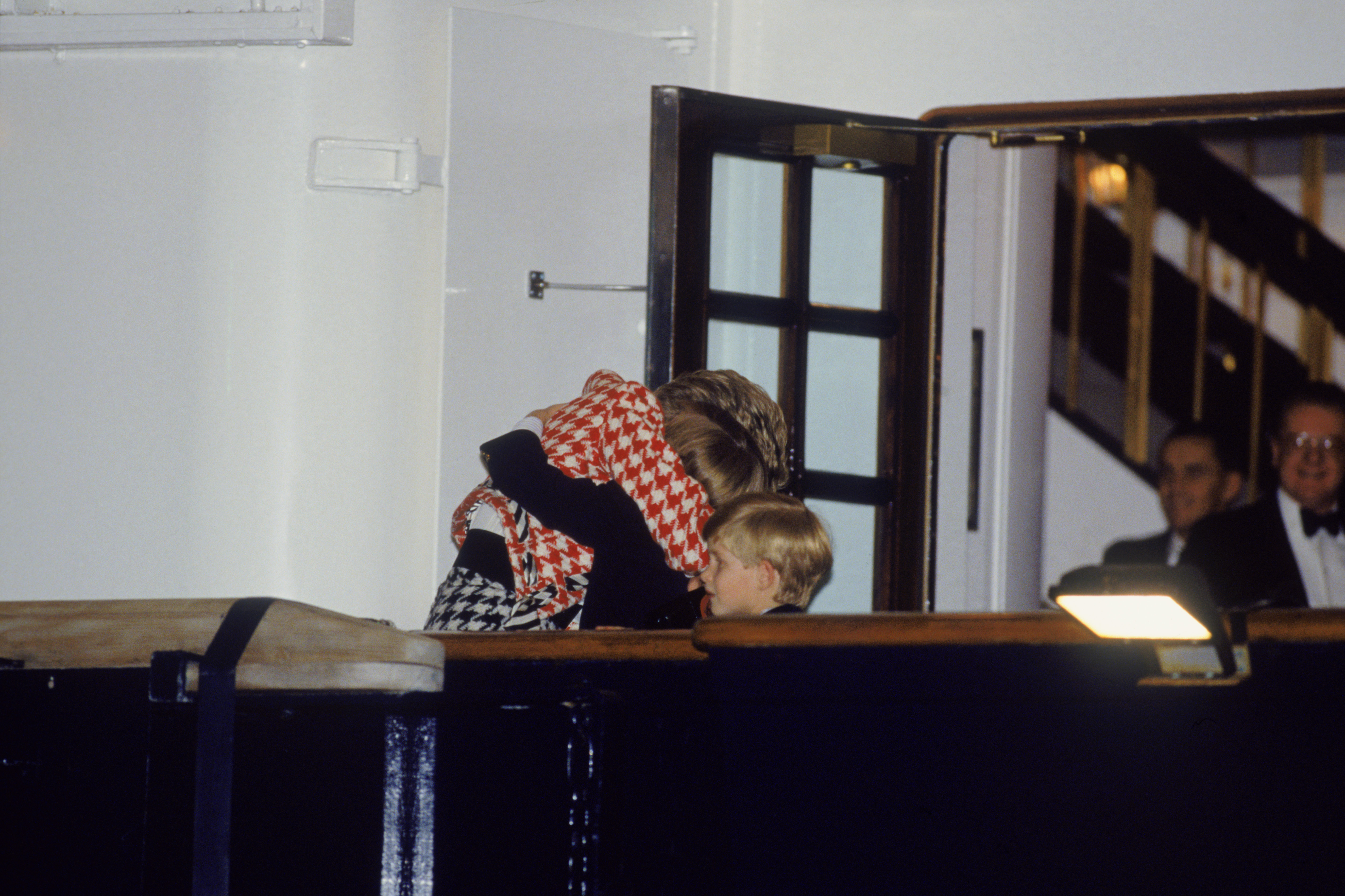 The Princess of Wales greets her sons Prince William and Prince Harry on the deck of the yacht Britannia in Toronto, when they joined their parents on an official visit to Canada, 23rd October 1991. The Princess is wearing a Moschino suit. (Photo by Jayne Fincher/Princess Diana Archive/Getty Images)
