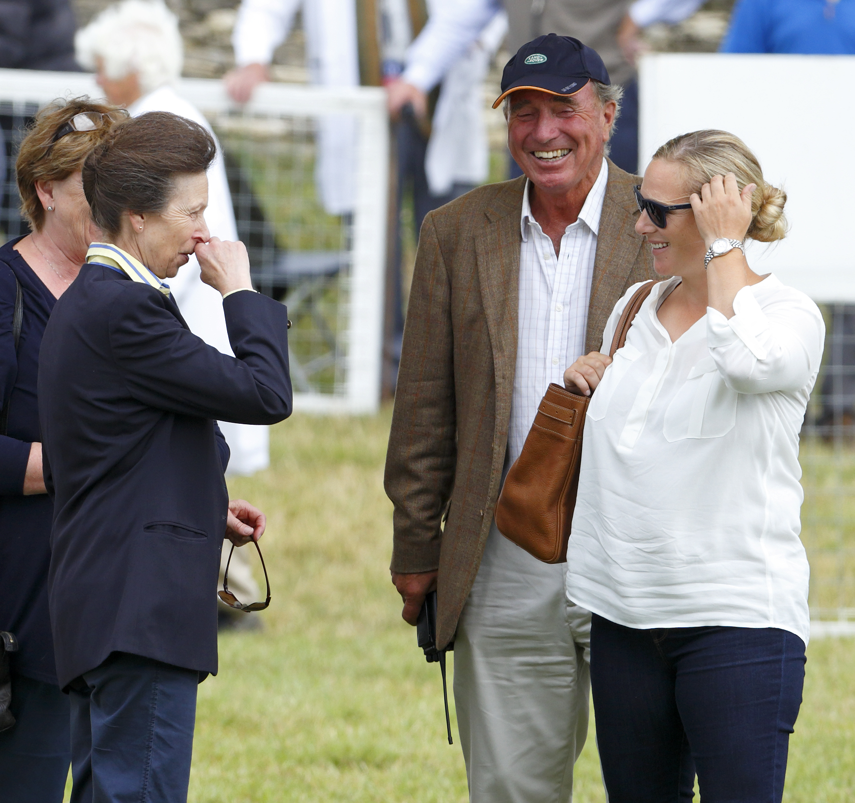 MINCHINHAMPTON, UNITED KINGDOM - AUGUST 01: (EMBARGOED FOR PUBLICATION IN UK NEWSPAPERS UNTIL 48 HOURS AFTER CREATE DATE AND TIME) Zara Phillips looks on as her mother Princess Anne, The Princess Royal and father Mark Phillips share a joke during day 1 of the Festival of British Eventing at Gatcombe Park on August 1, 2014 in Minchinhampton, England. (Photo by Max Mumby/Indigo/Getty Images)