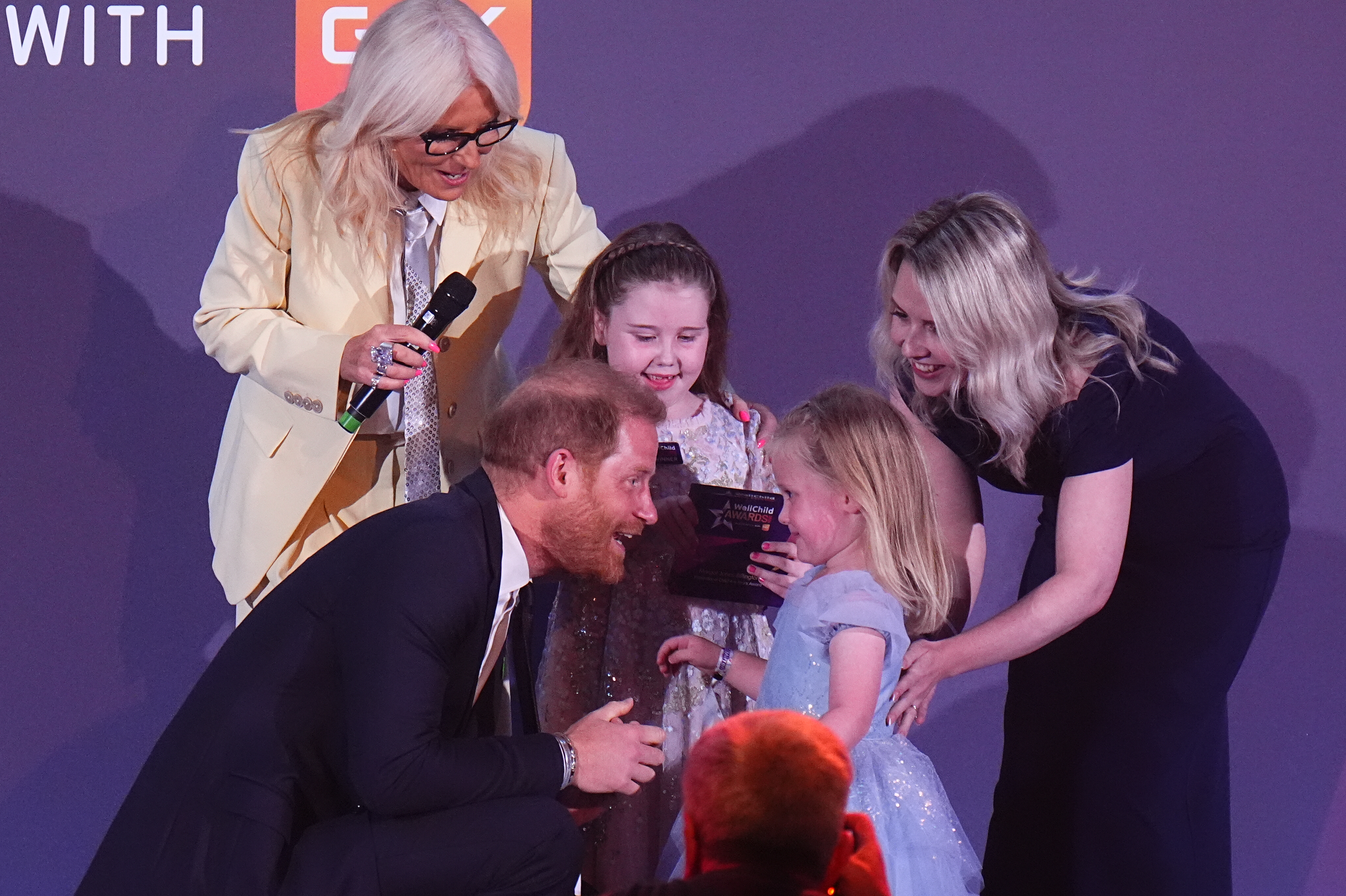 LONDON, ENGLAND - SEPTEMBER 21: Prince Harry, Duke of Sussex speaks to Adeleigh, the sister of Inspirational Child 4-6 award to winner, Margot Jones-Billington (C), during the 2026 Wellchild Awards at the Royal Lancaster Hotel on September 21, 2026 in London, England. (Photo by Aaron Chown - Pool/Getty Images)