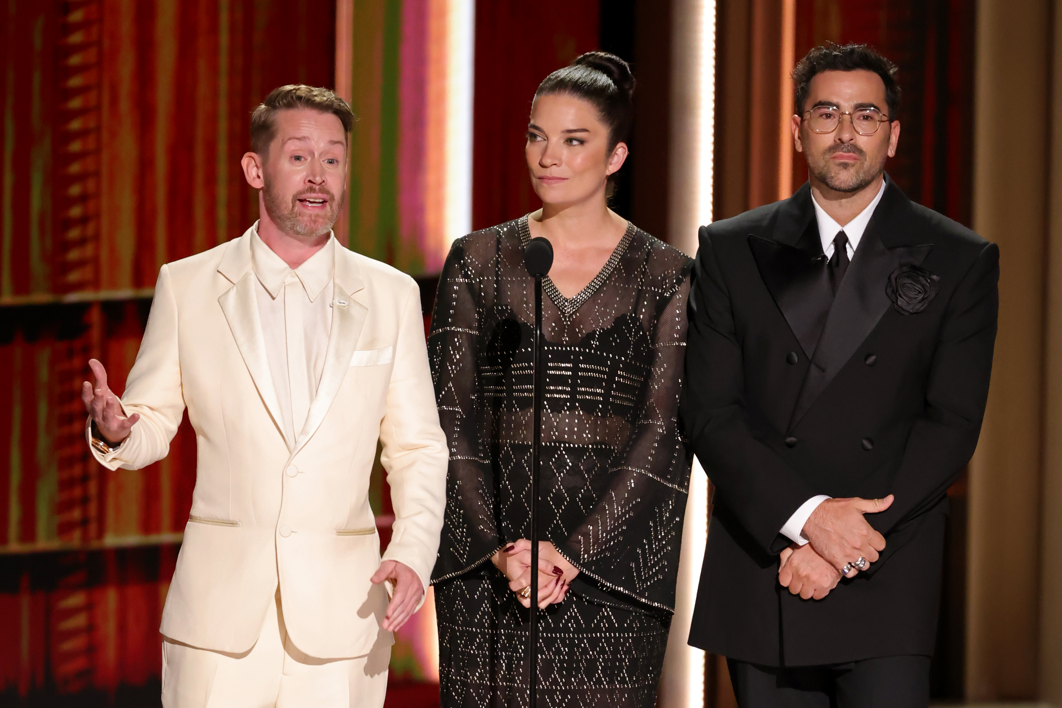 LOS ANGELES, CALIFORNIA - SEPTEMBER 14: (L-R) Macaulay Culkin, Annie Murphy, and Dan Levy speak onstage during the 78th Primetime Emmy Awards at Peacock Theater on September 14, 2026 in Los Angeles, California.  (Photo by Kevin Winter/Getty Images)