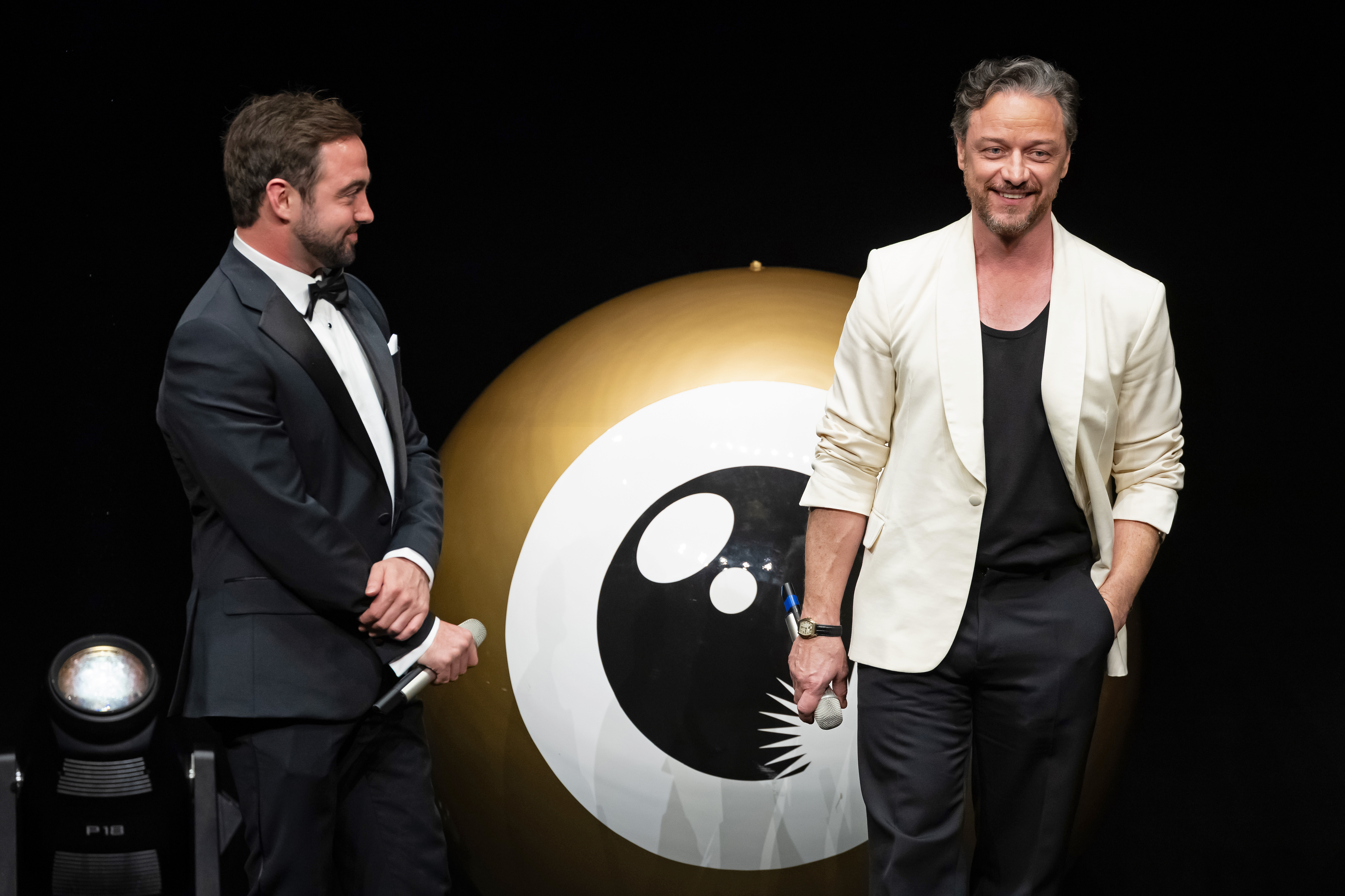 ZURICH, SWITZERLAND - OCTOBER 04: Danny Page and James McAvoy speak on stage during the Award Night of the 21st Zurich Film Festival at Opera House on October 04, 2025 in Zurich, Switzerland. (Photo by Andreas Rentz/Getty Images for ZFF)