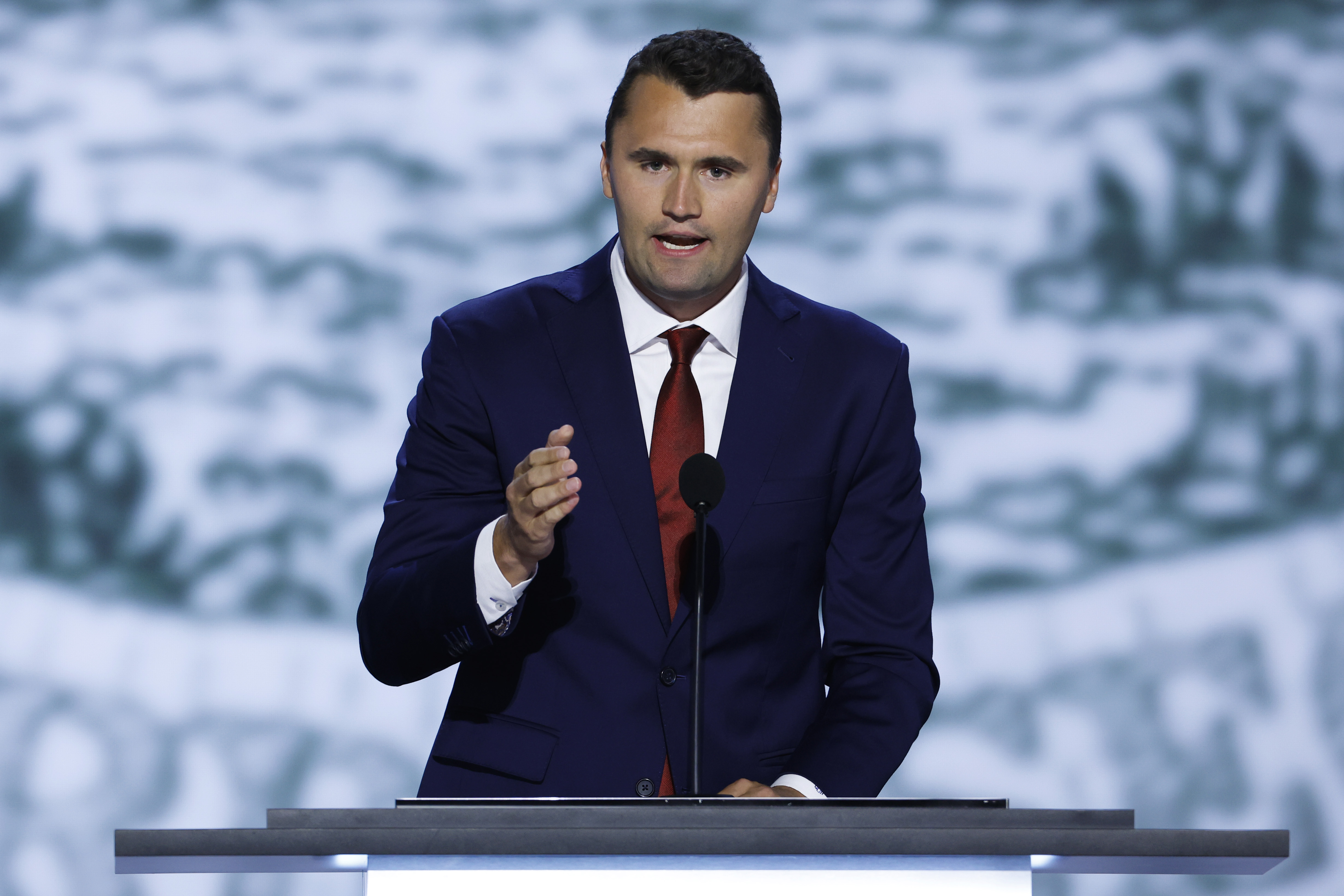 MILWAUKEE, WISCONSIN - JULY 15: CEO of Turning Point USA Charlie Kirk speaks on stage on the first day of the Republican National Convention at the Fiserv Forum on July 15, 2024 in Milwaukee, Wisconsin. Delegates, politicians, and the Republican faithful are in Milwaukee for the annual convention, concluding with former President Donald Trump accepting his party's presidential nomination. The RNC takes place from July 15-18. (Photo by Chip Somodevilla/Getty Images)
