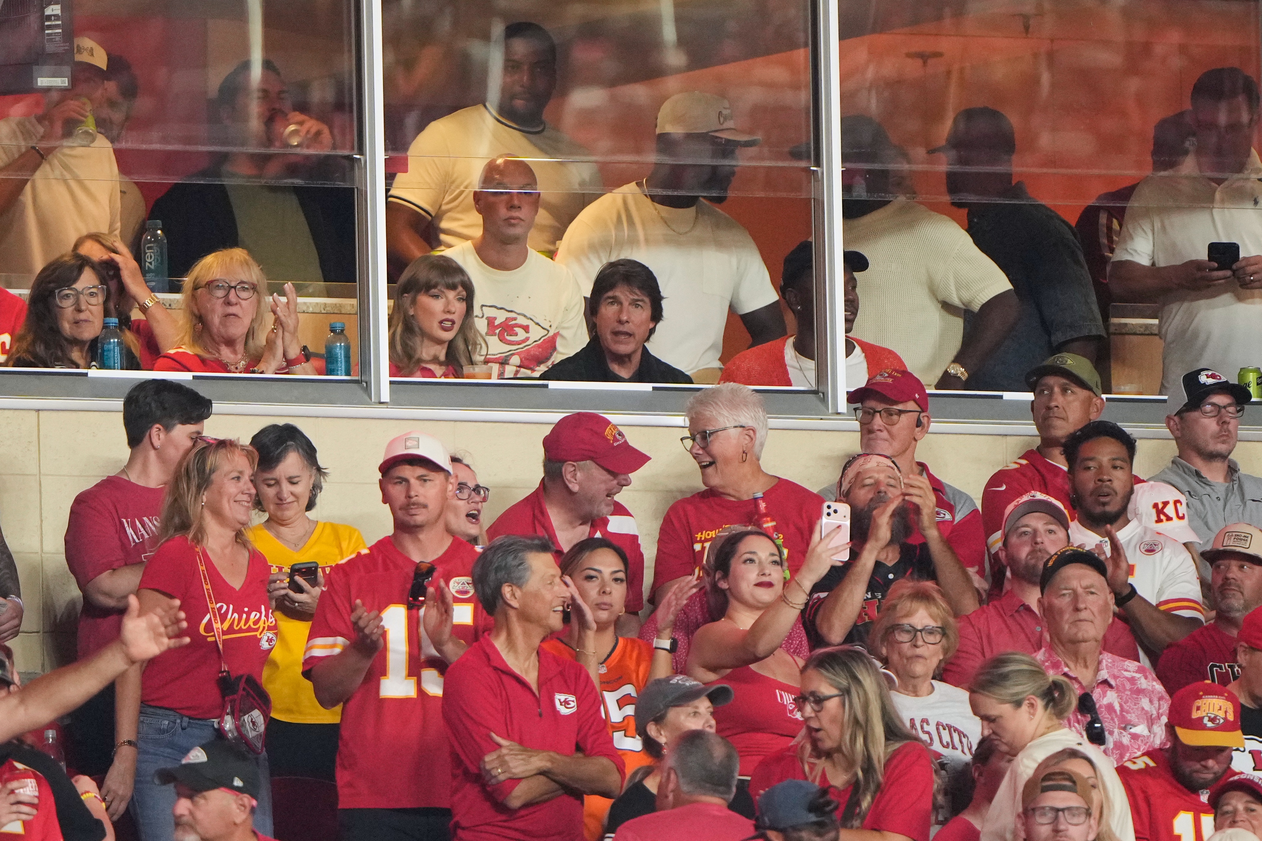 Taylor Swift, center left, sits with Tom Cruise, center, while watching the first half of an NFL football game between the Kansas City Chiefs and the Denver Broncos, Monday, Sept. 14, 2026, in Kansas City, Mo. (AP Photo/Charlie Riedel)