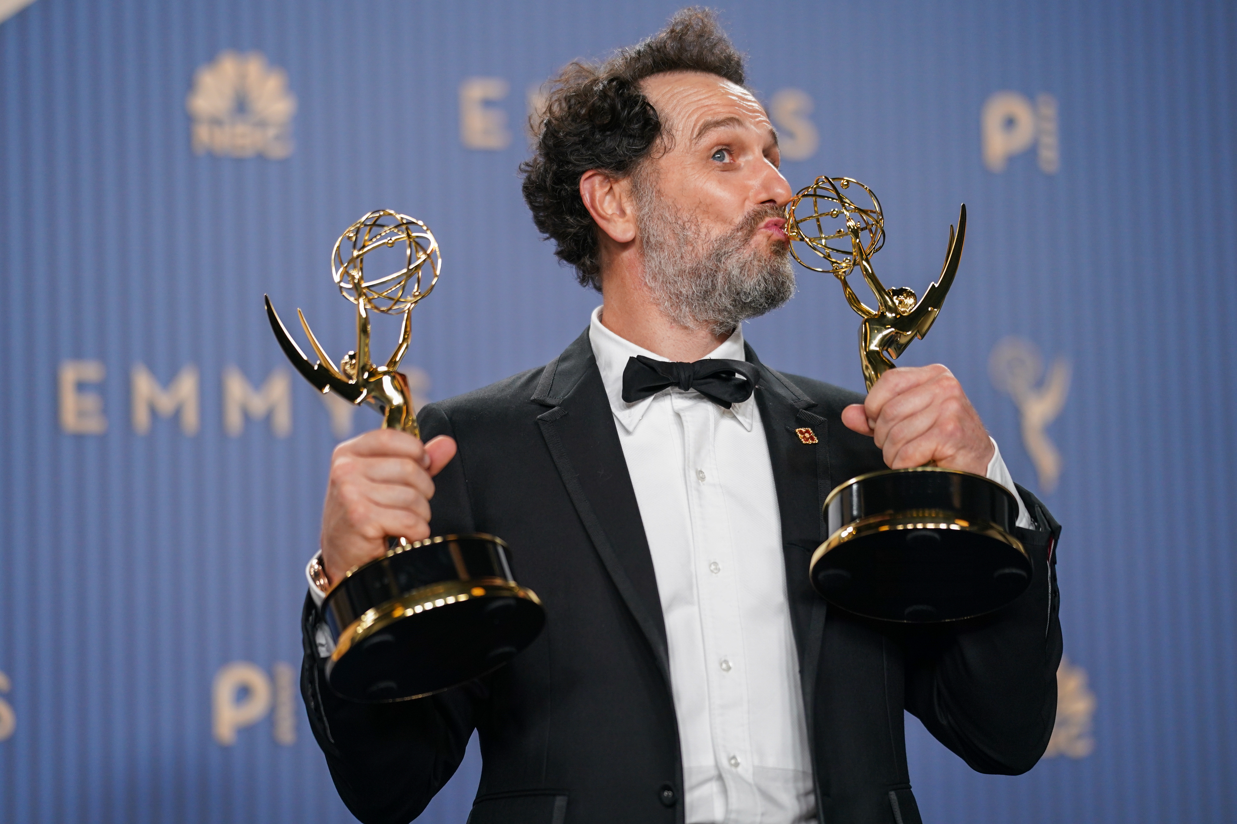 Matthew Rhys poses in the press room with the awards for outstanding lead actor in a limited or anthology series or movie for