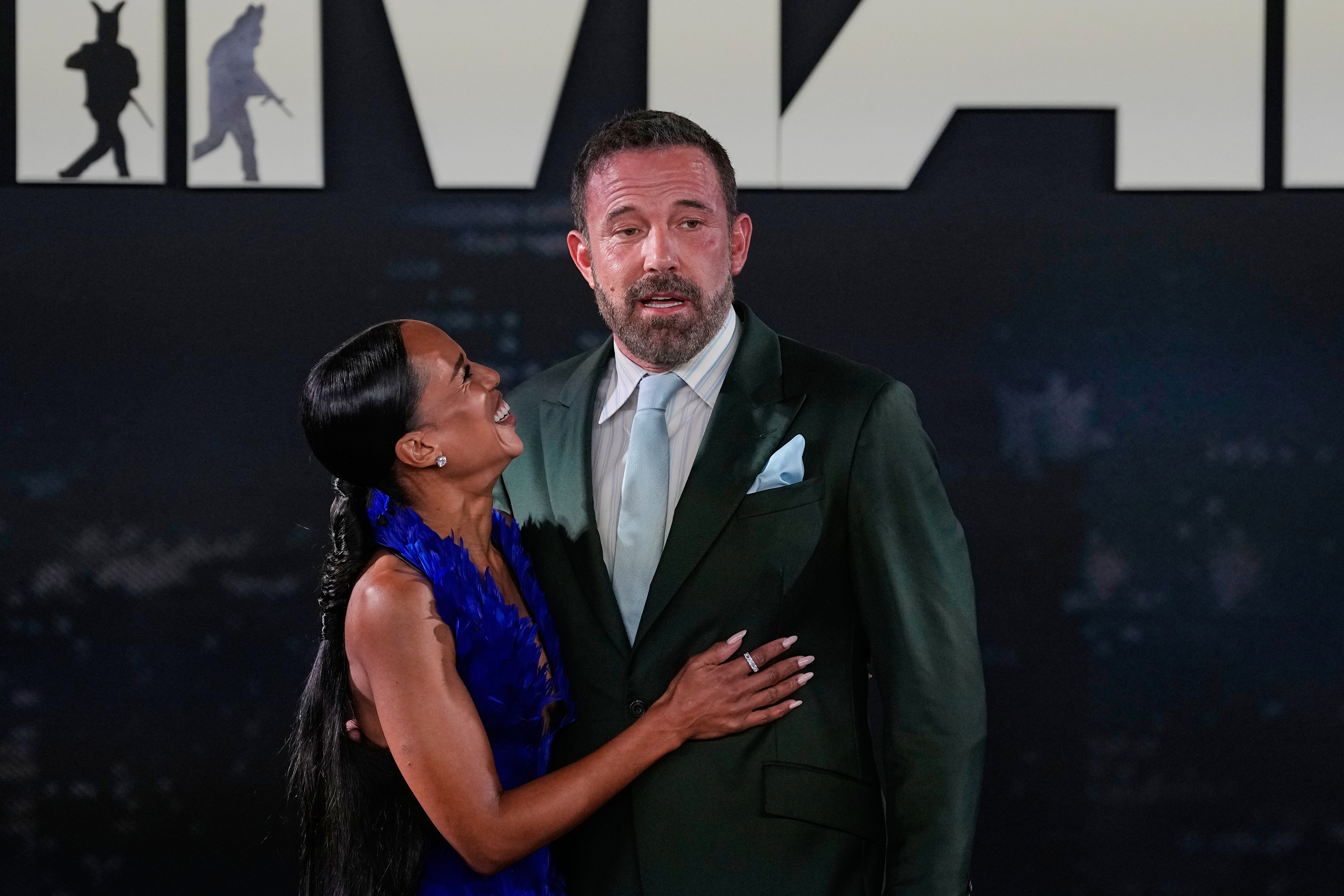 Kerry Washington and Ben Affleck pose during a red carpet fan event promoting the film